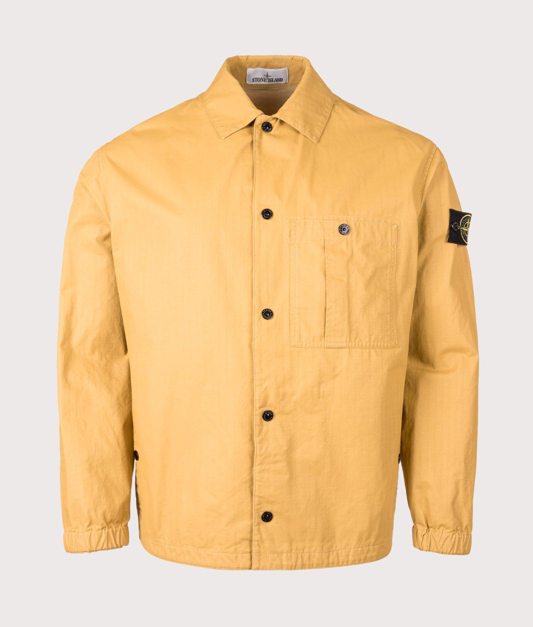 Stone Island Relaxed Fit Double Coated Cotton Ripstop Overshirt in Mustard at EQVVS Menswear.  Front shot 