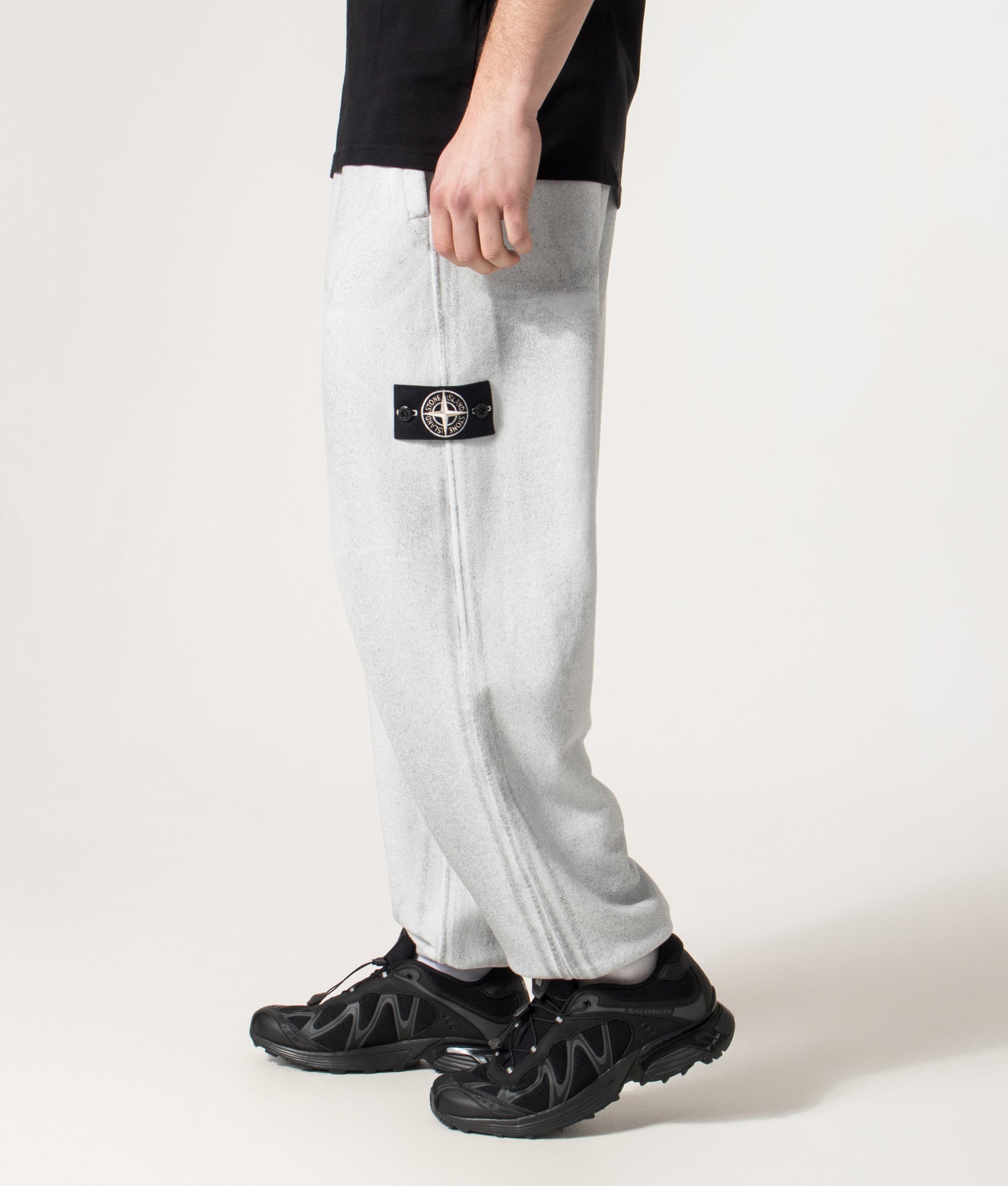 Loose Fit Reflect Joggers in Sky Blue | Stone Island | EQVVS | Side model shot 