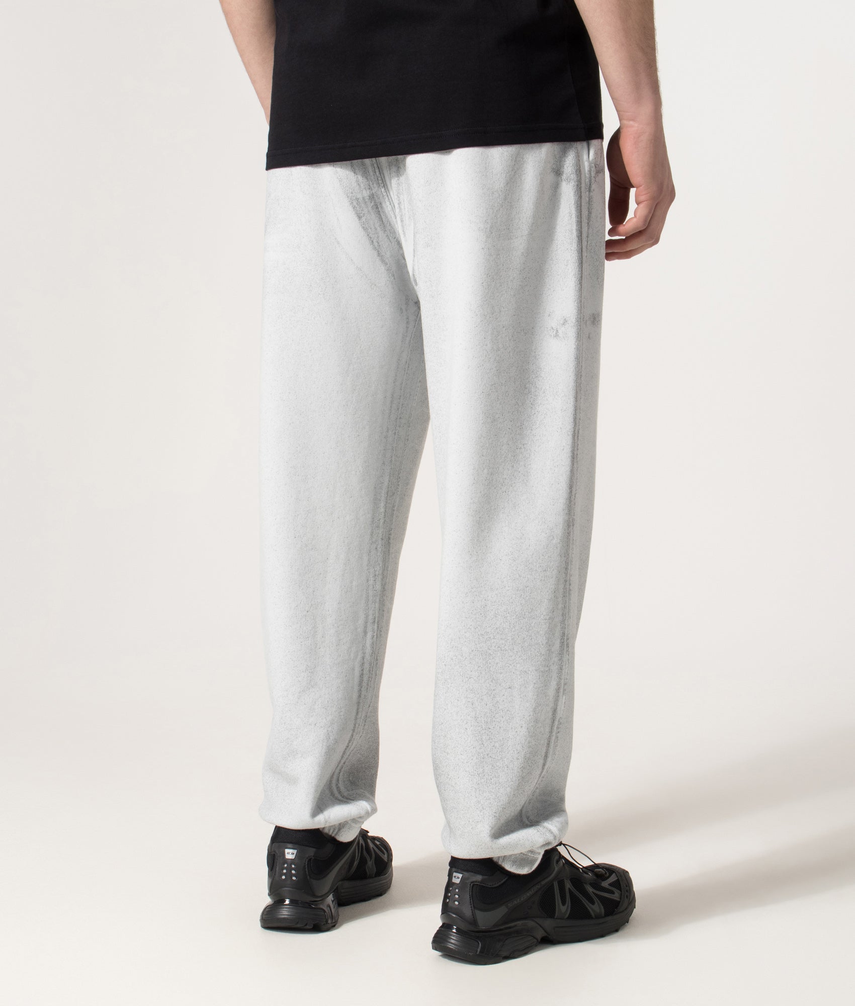 Loose Fit Reflect Joggers in Sky Blue | Stone Island | EQVVS | Back model angle shot