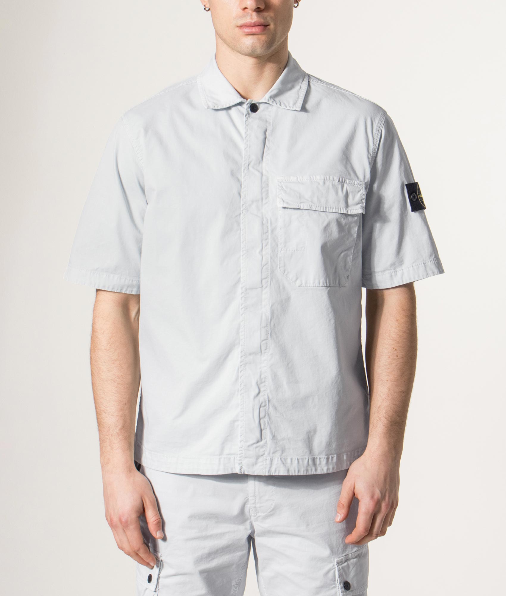 Stone Island Short Sleeve Shirt in Sky Blue at EQVVS Menswear. Model front shot.