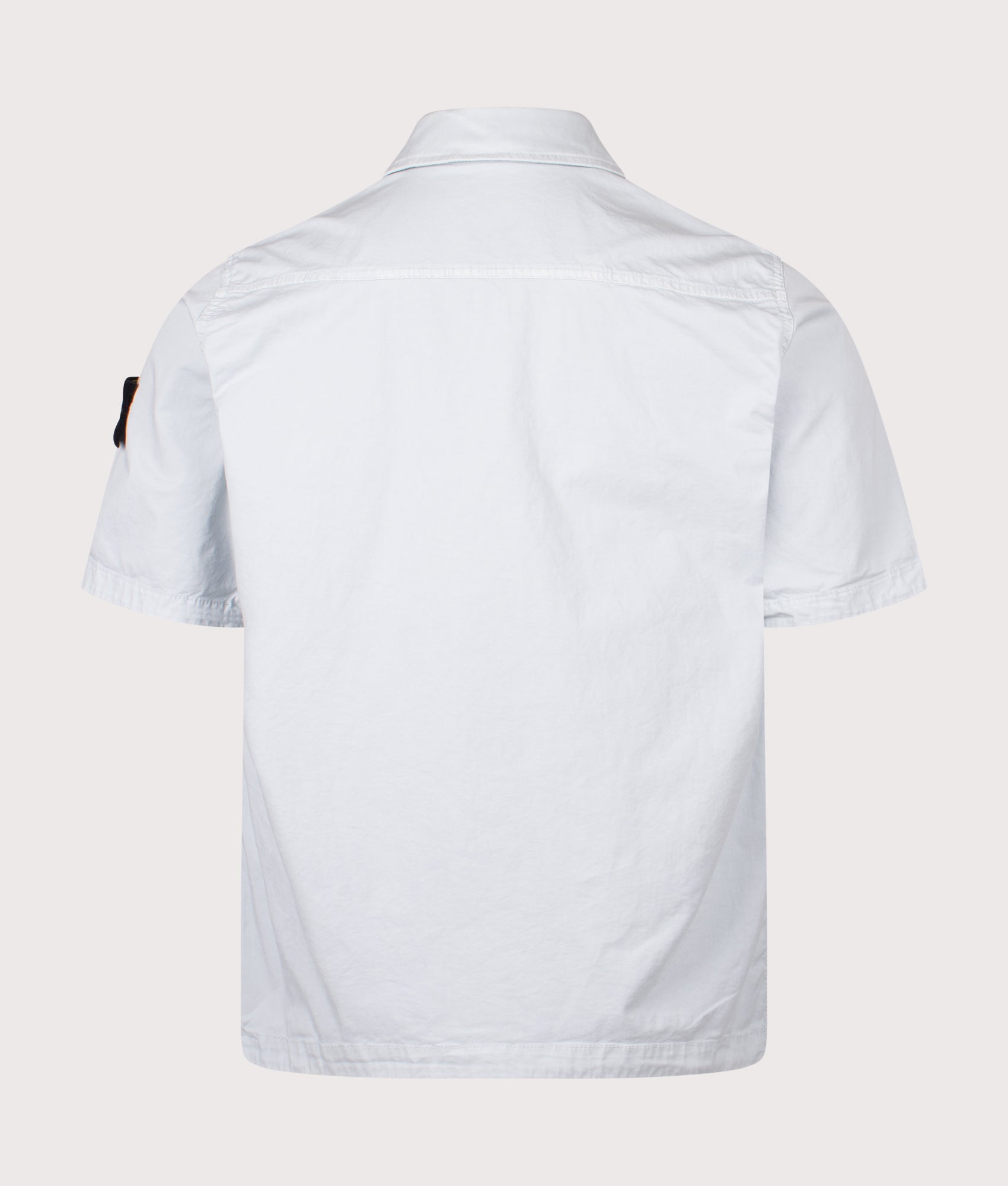 Stone Island Short Sleeve Shirt in Sky Blue at EQVVS Menswear. Back shot.