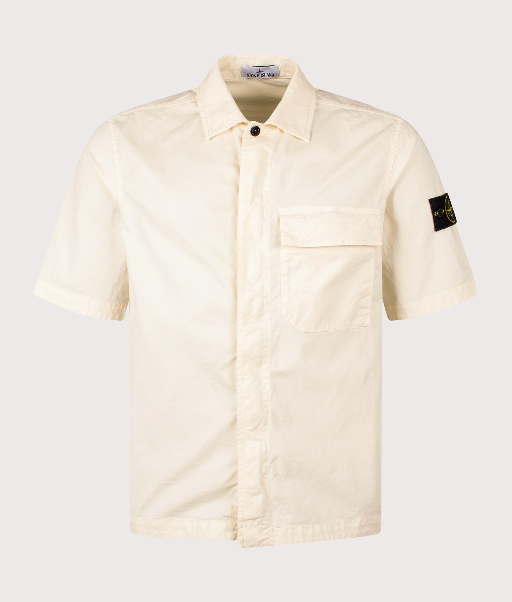 Stone Island Relaxed Fit Short Sleeve Shirt in Ivory at EQVVS Menswear. Front shot.