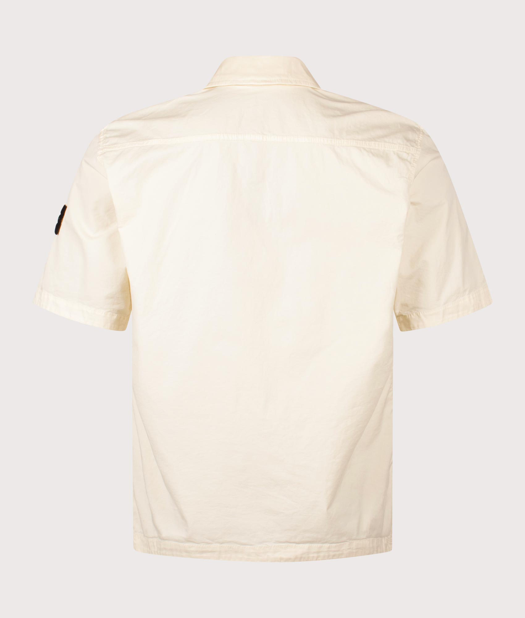 Stone Island Relaxed Fit Short Sleeve Shirt in Ivory at EQVVS Menswear. Back shot.