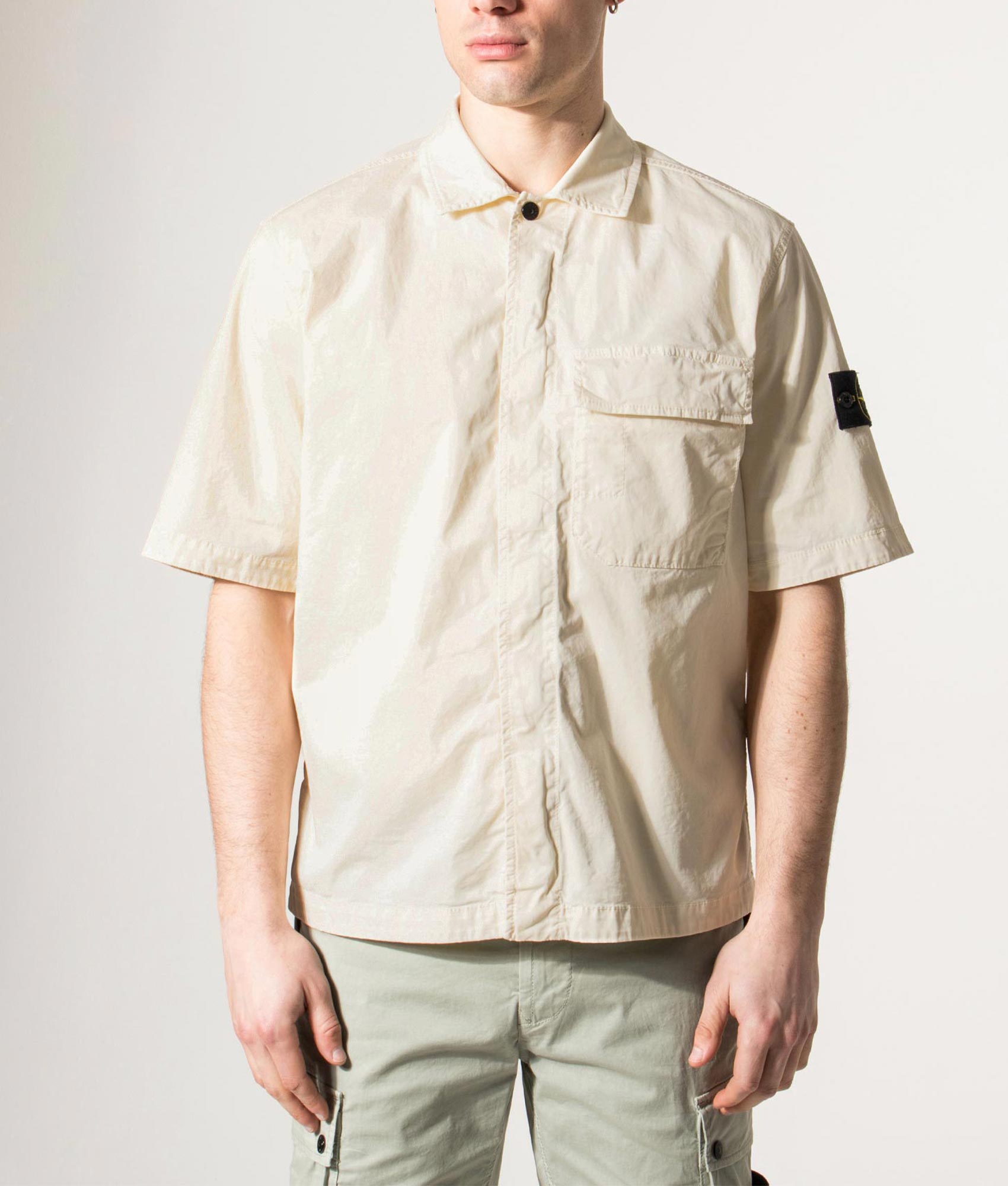 Stone Island Relaxed Fit Short Sleeve Shirt in Ivory at EQVVS Menswear. Model front shot.