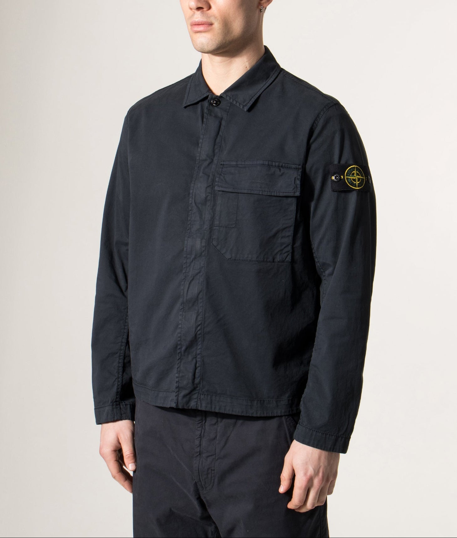 STONE ISLAND Stretch Cotton Twill Overshirt in Dark Navy at EQVVS Menswear. Model angled front shot. 