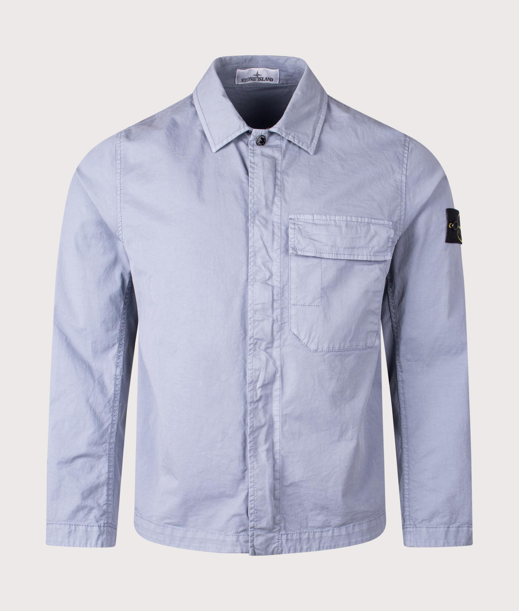 Stone Island Stretch Organic Cotton Twill Overshirt in Avio Blue at EQVVS Menswear. Front shot.