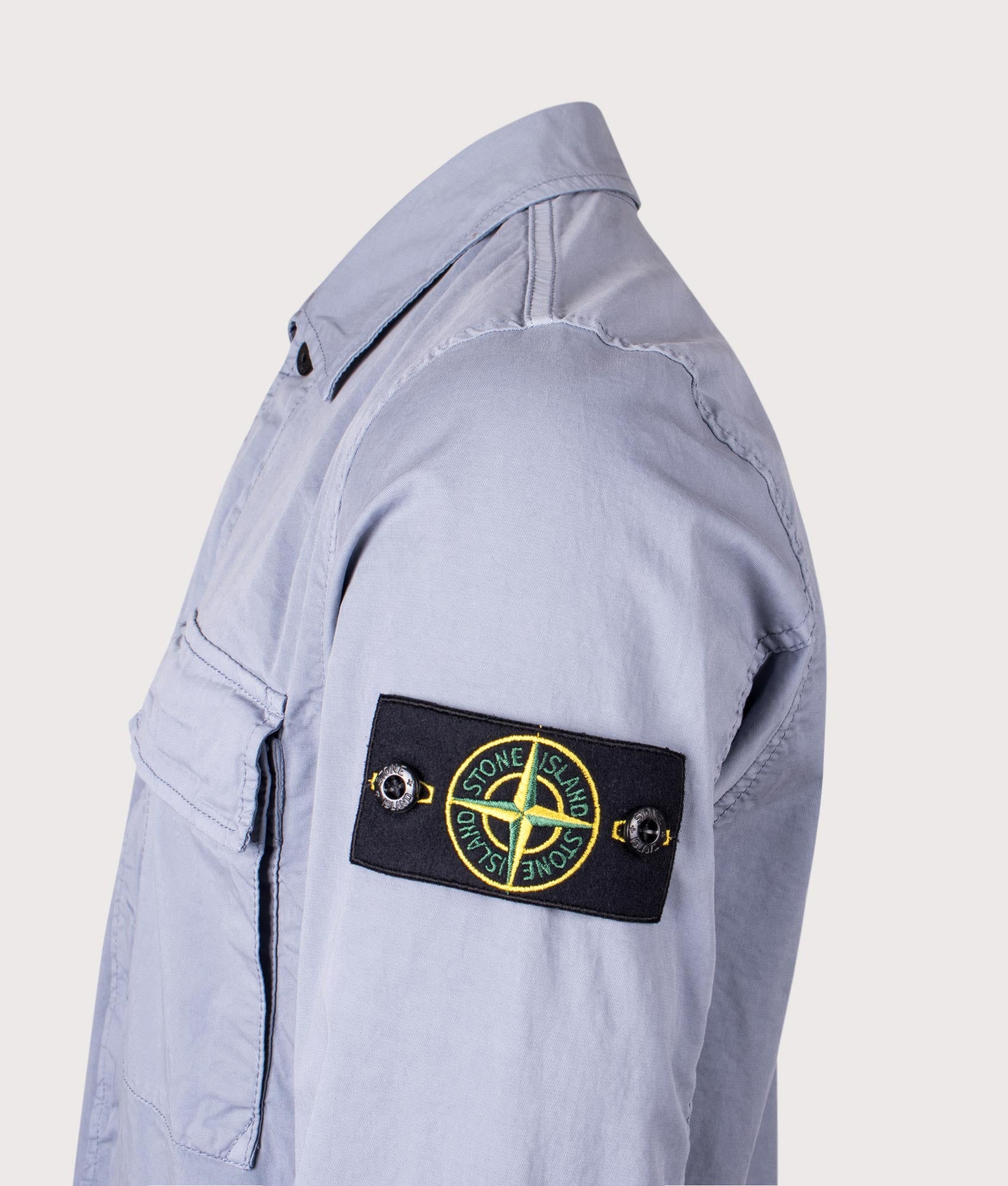 Stone Island Stretch Organic Cotton Twill Overshirt in Avio Blue at EQVVS Menswear. Detail shot.