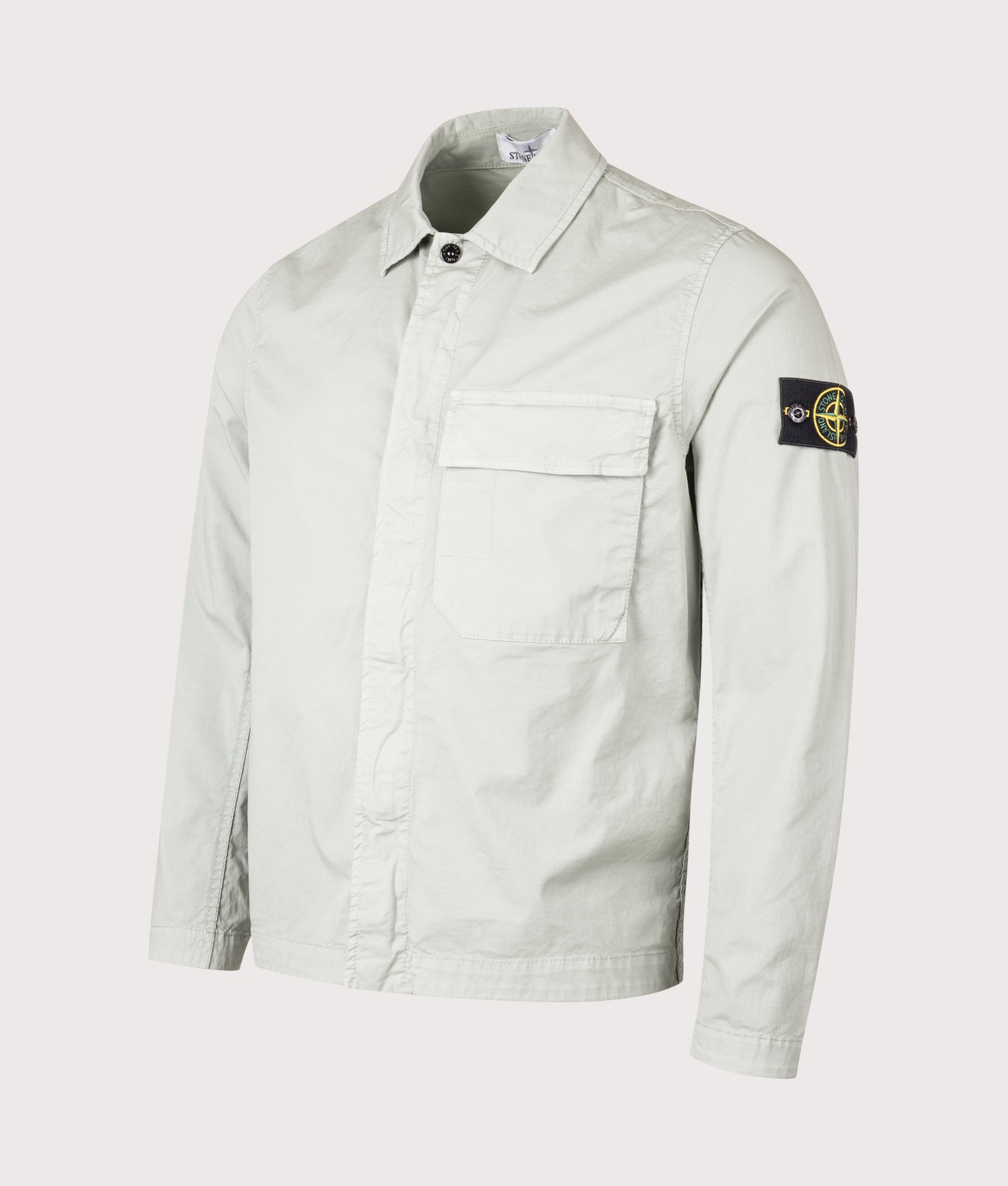 Stone Island Pocket Overshirt in Sage at EQVVS Menswear. Angled front shot. 