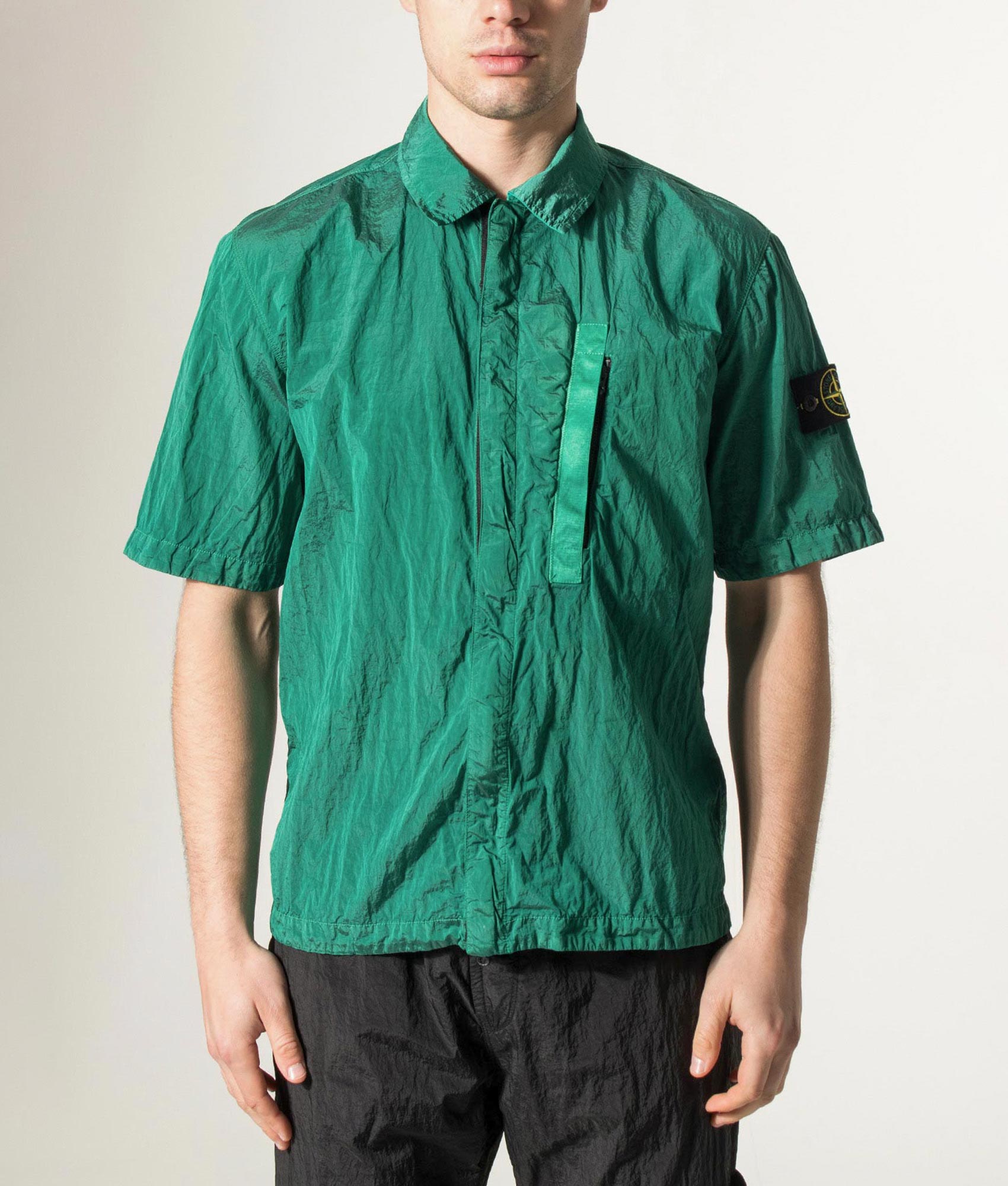 Stone Island Comfort Fit Nylon Metal in ECONYL® Short Sleeve Shirt in V005H Malachite at EQVVS Menswear. Model front shot.