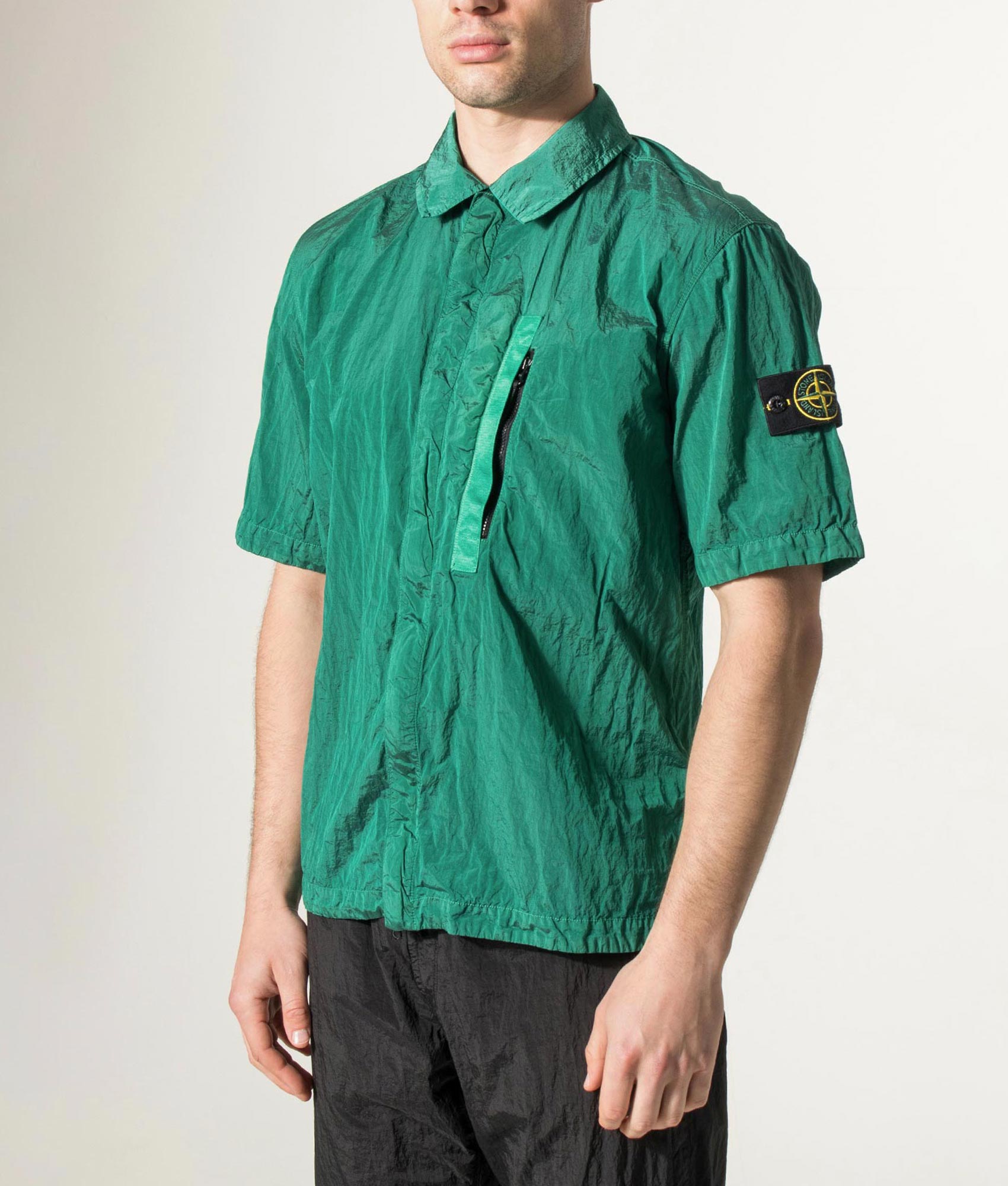 Stone Island Comfort Fit Nylon Metal in ECONYL® Short Sleeve Shirt in V005H Malachite at EQVVS Menswear. Angled model front shot.