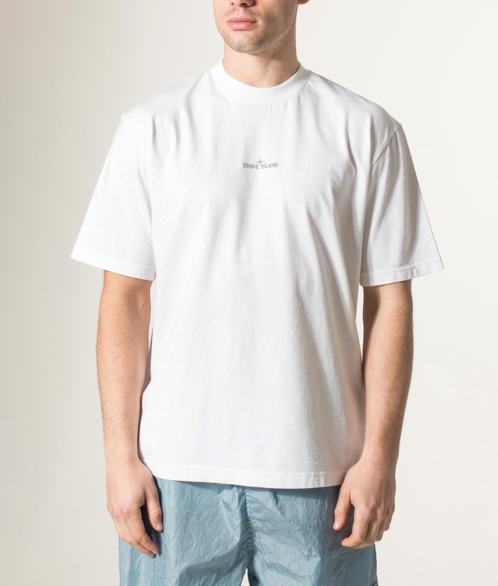 Stone island Carlo Rivetti T-Shirt in White at EQVVS Menswear. Model Front shot.