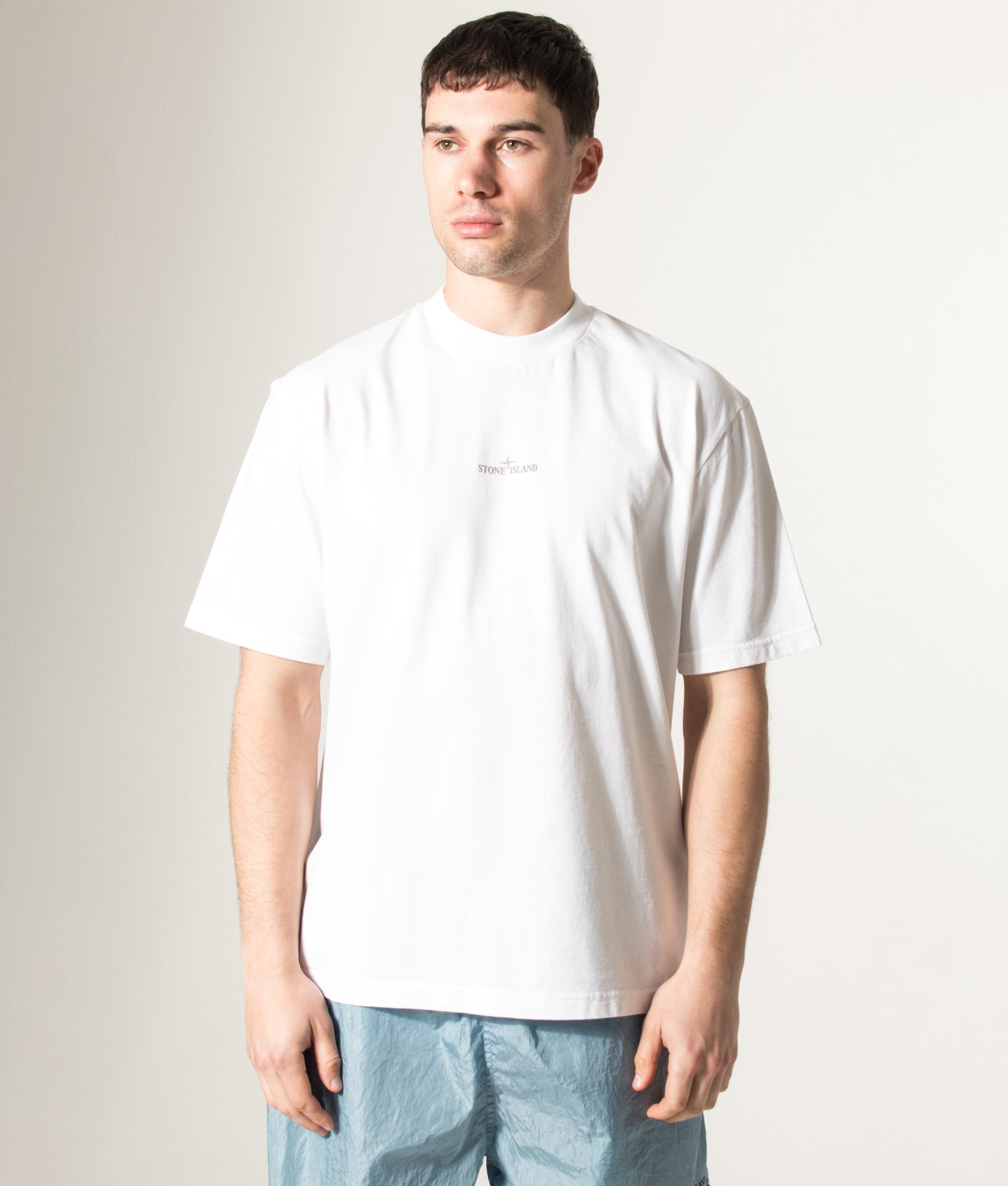 Stone island Carlo Rivetti T-Shirt in White at EQVVS Menswear. Model front shot.