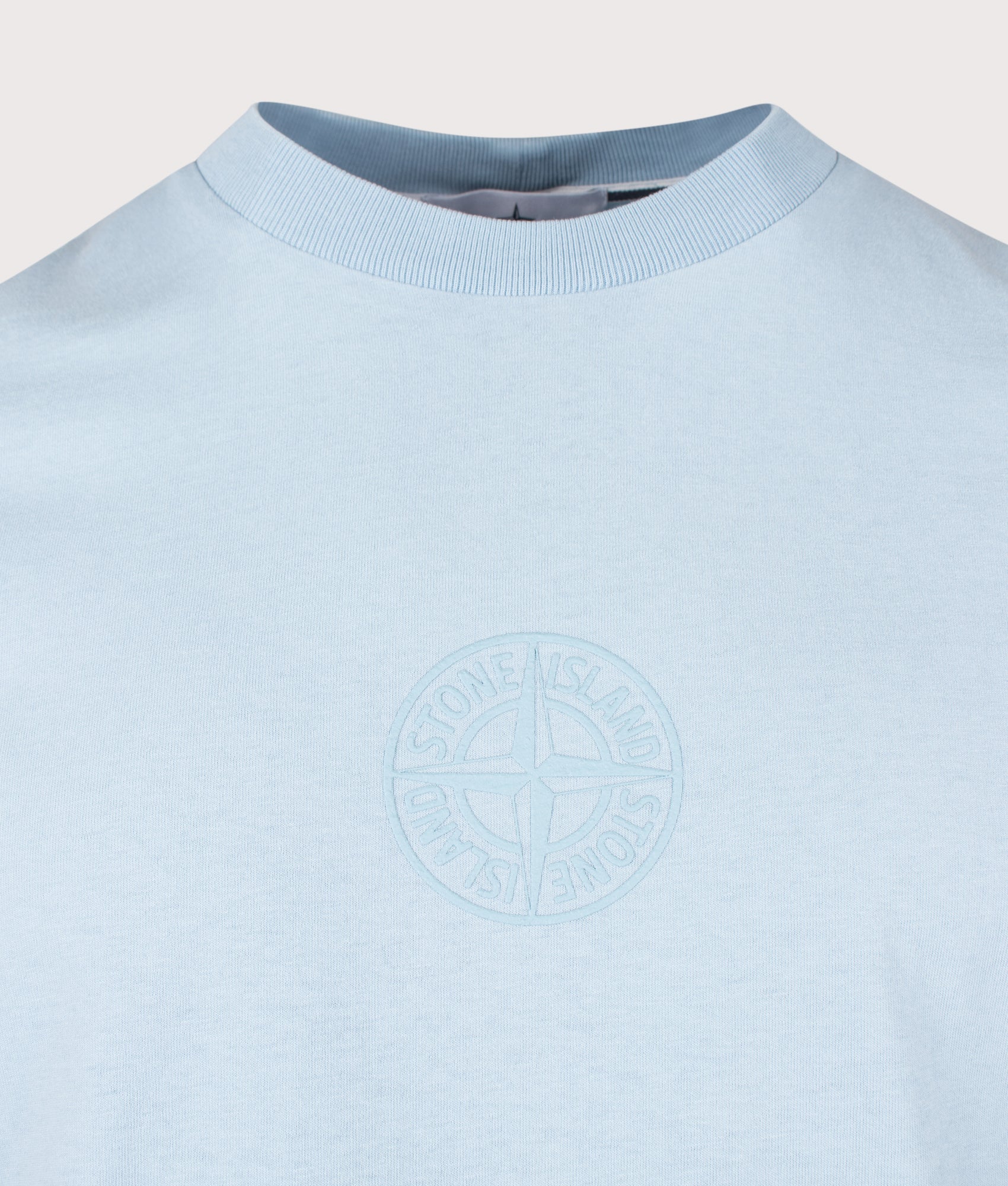 Stone Island ‘Camo Compass’ Print T-Shirt in Powder Blue at EQVVS Menswear. Detail shot.