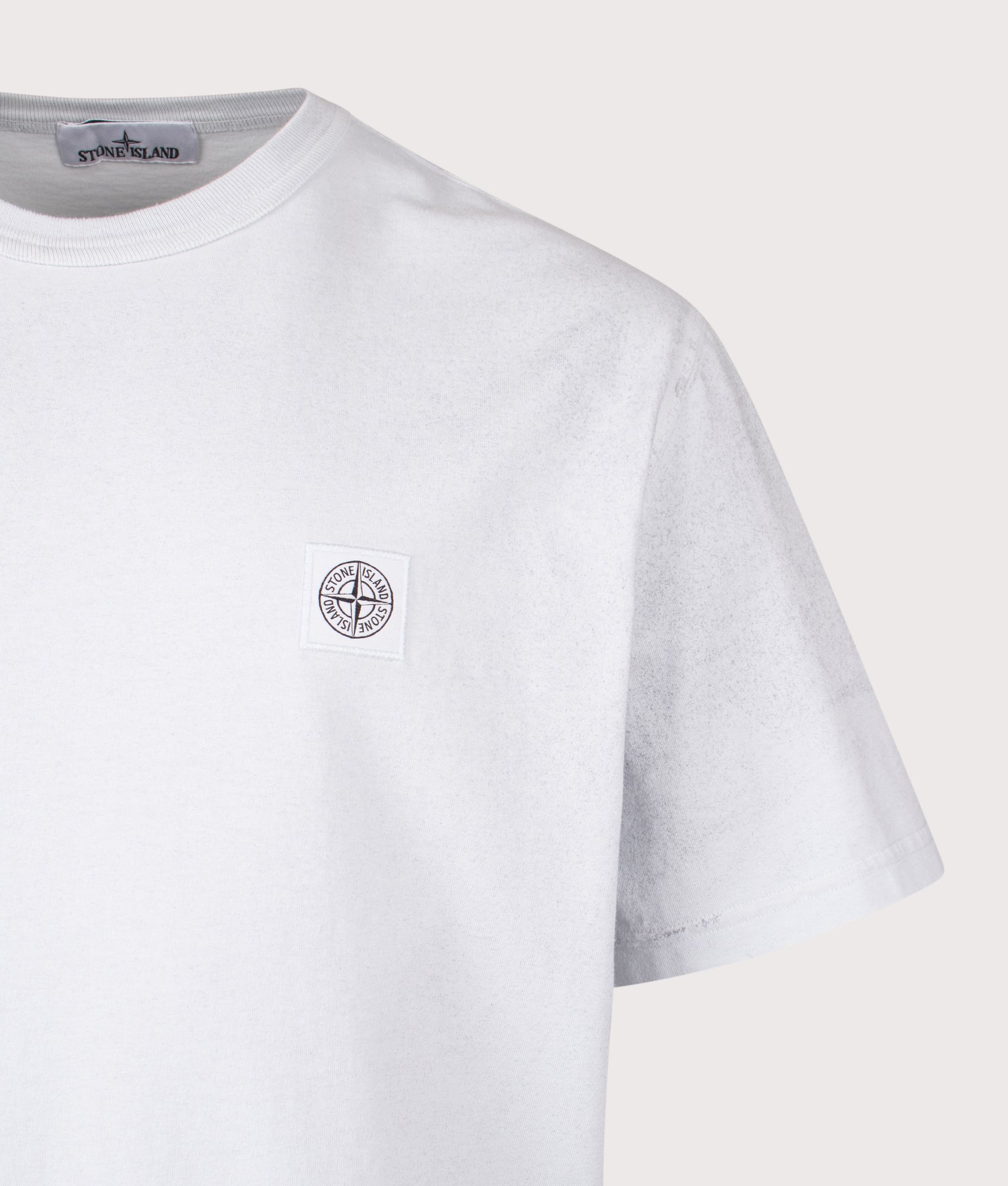 Stone Island Reflective Compass Badge T-Shirt in Sky Blue at EQVVS Menswear. Detail shot.