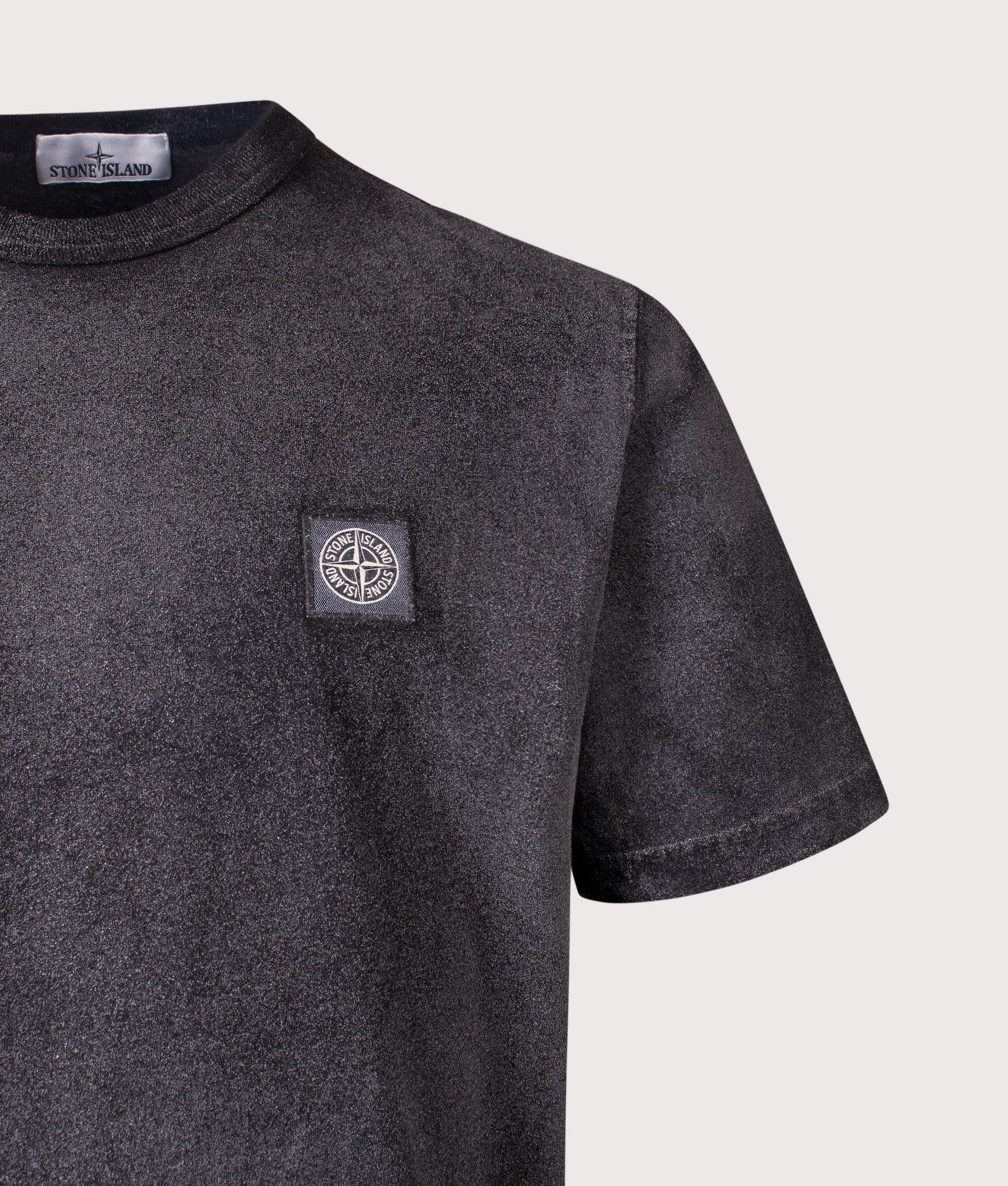 Stone Island Reflective Compass Badge Short Sleeve T-Shirt in Black at EQVVS Menswear. Detail shot.