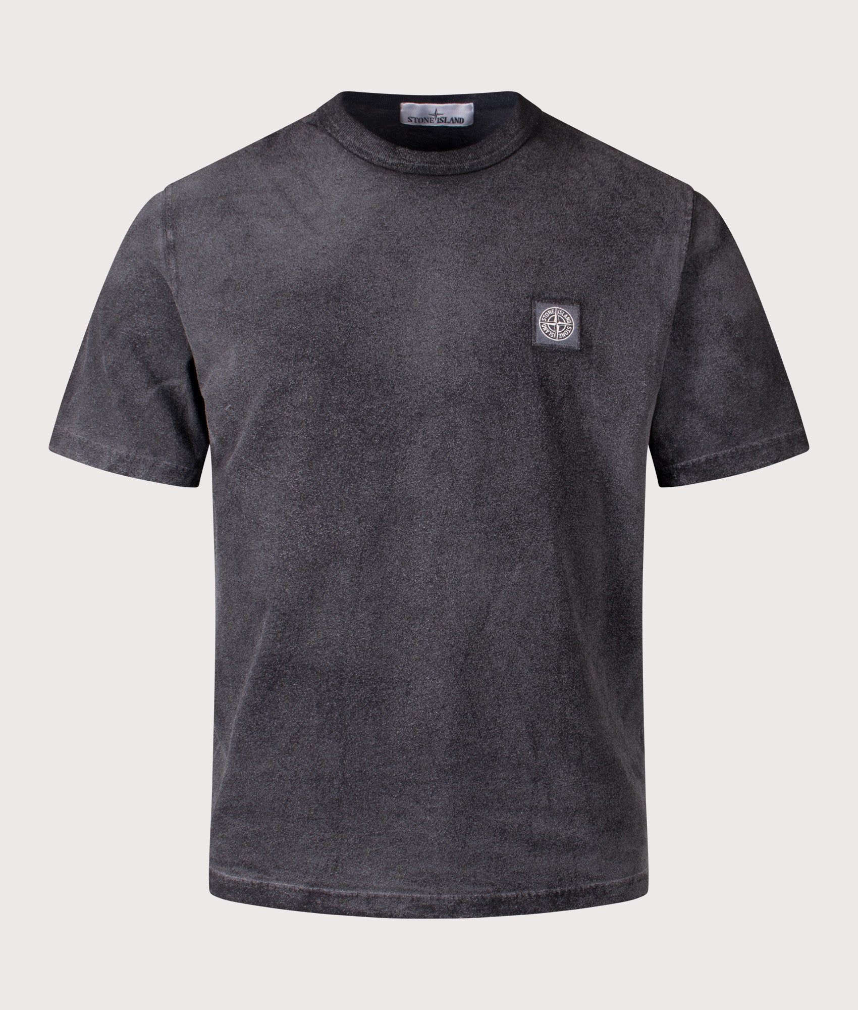 Stone Island Reflective Compass Badge Short Sleeve T-Shirt in Black at EQVVS Menswear. Front shot.