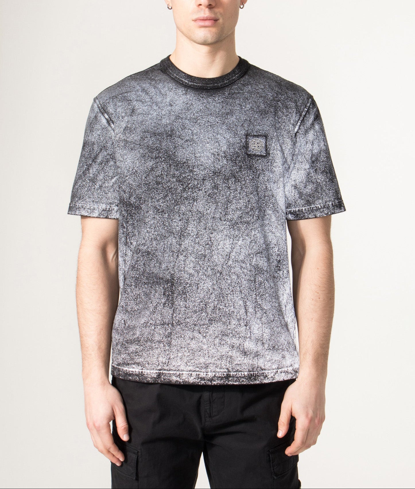 Stone Island Reflective Compass Badge Short Sleeve T-Shirt in Black at EQVVS Menswear. Model reflective shot.