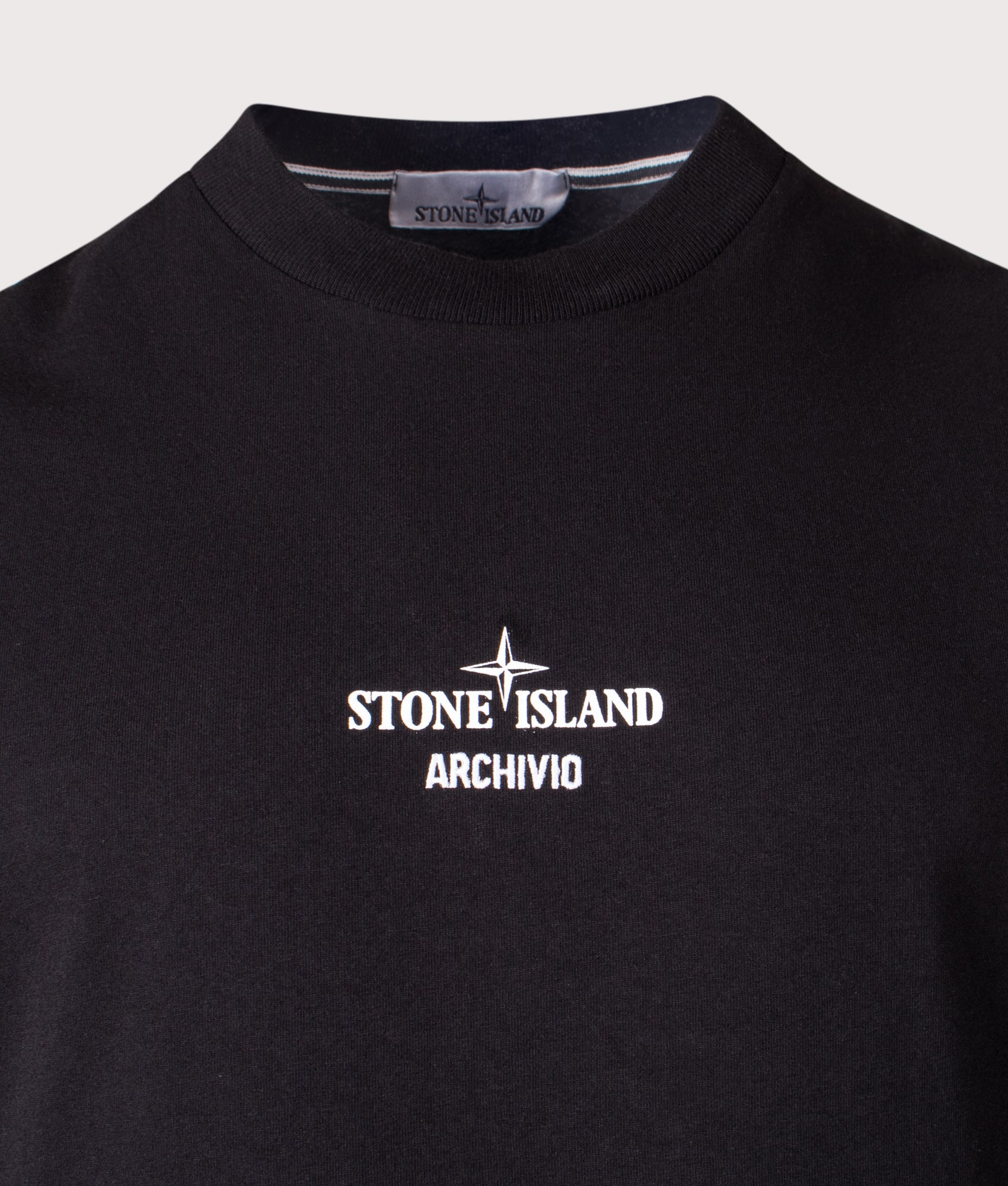 Stone Island ‘Archivio’ print T-Shirt in Black at EQVVS Menswear. Detail shot.