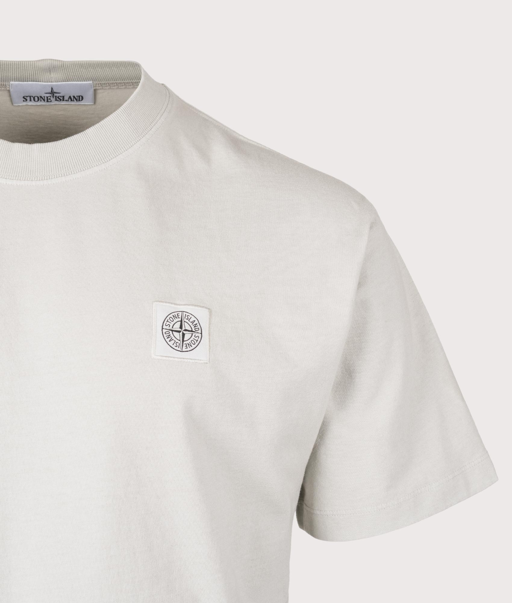 Stone Island Compass Patch T-Shirt in Pearl Grey at EQVVS Menswear. Detail shot.