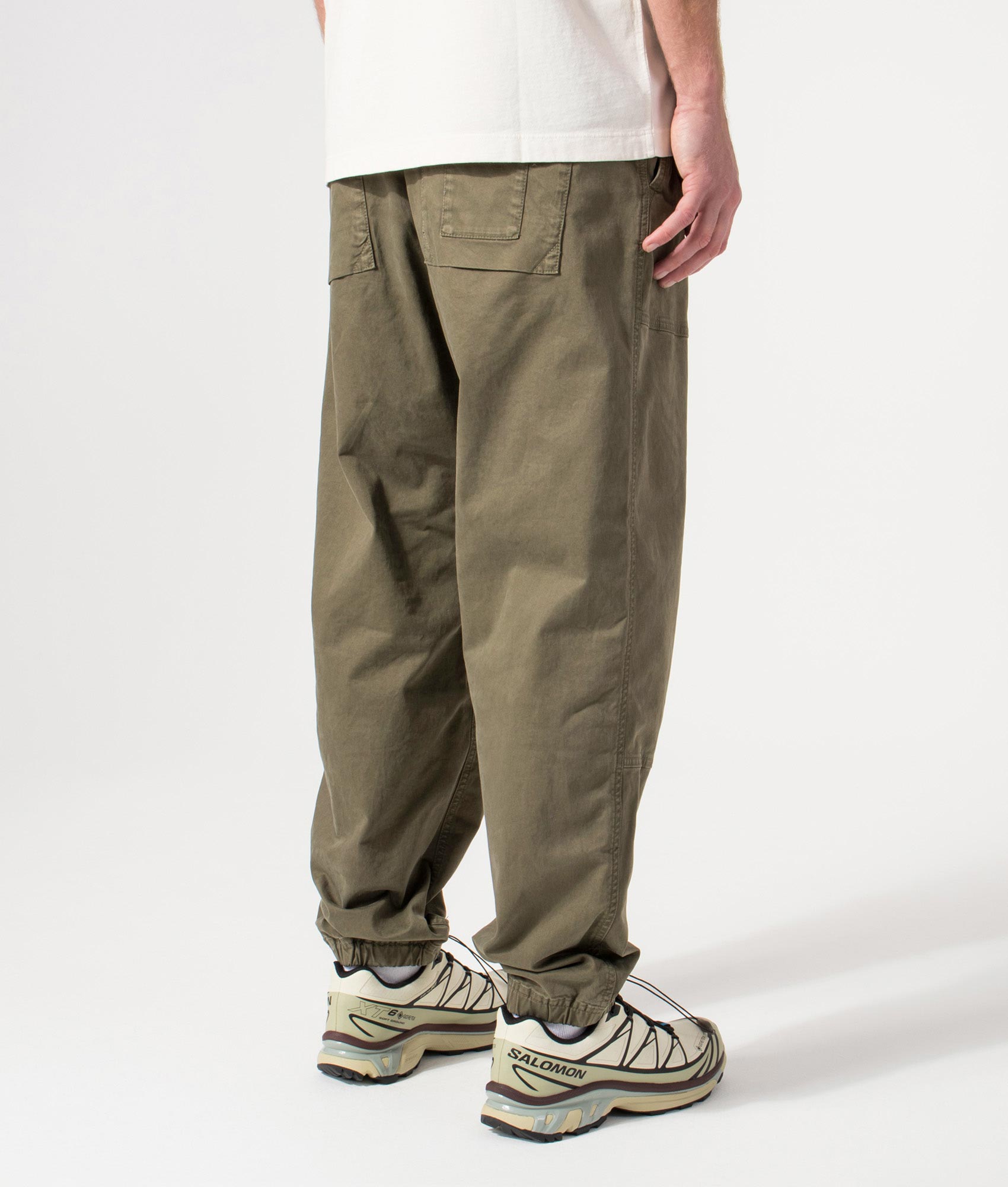 Organic Twill Cargo Pants in Military Green by Stone Island. Back shot. Shot by EQVVS