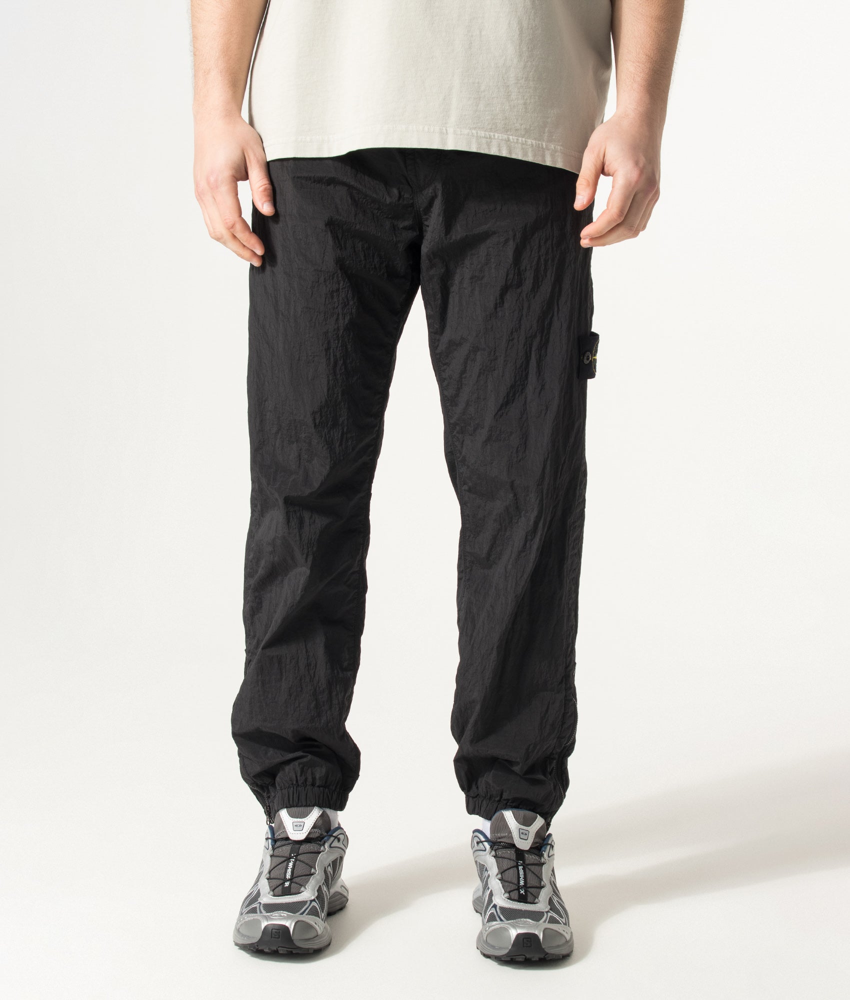 Stone Island Nylon Metal in Econyl® Trousers in Black at EQVVS Menswear. Model front shot.