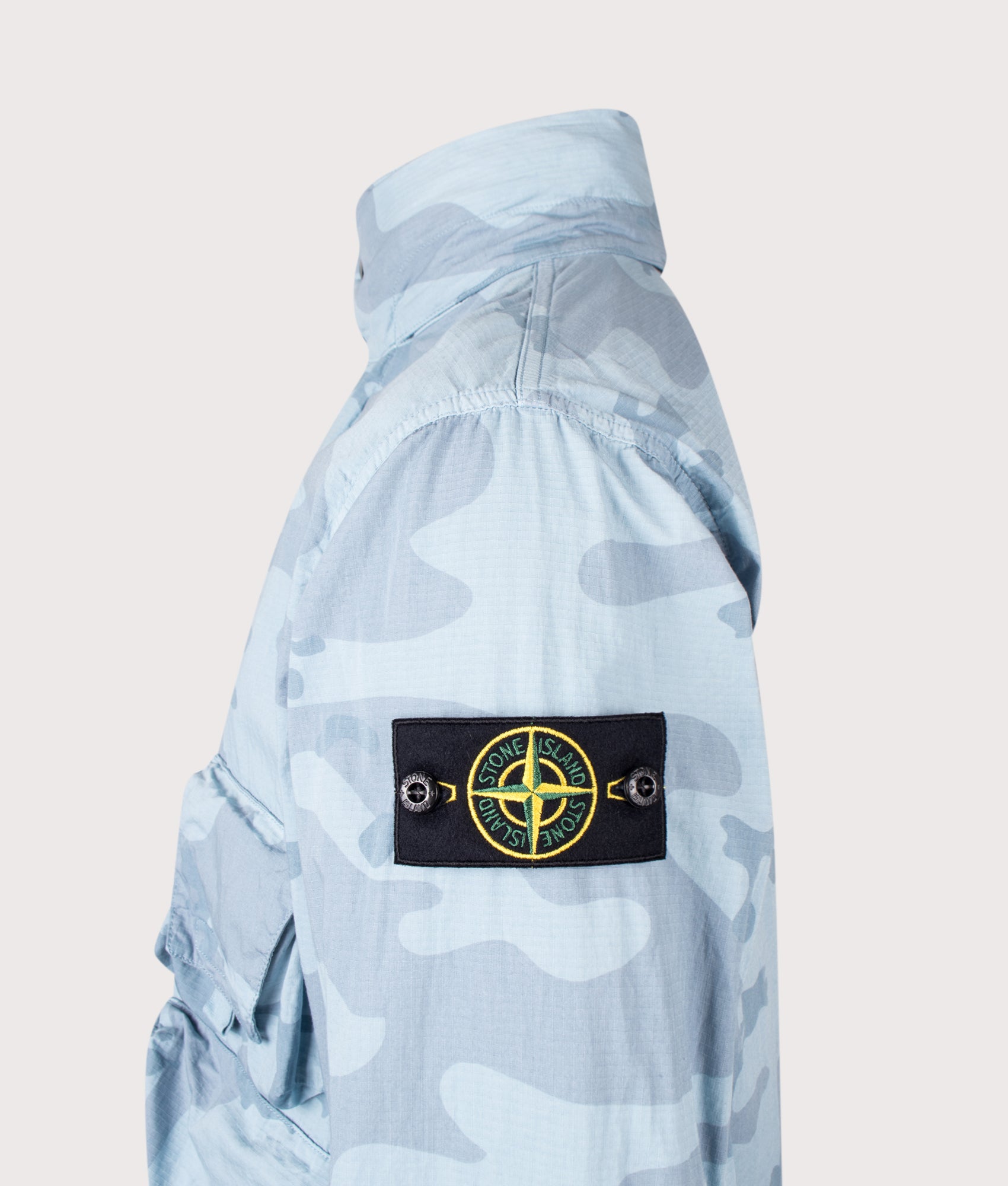 Stone Island Faded Camo Light Ripstop-OVD Field Jacket in Powder Blue at EQVVS Menswear. Detail shot.