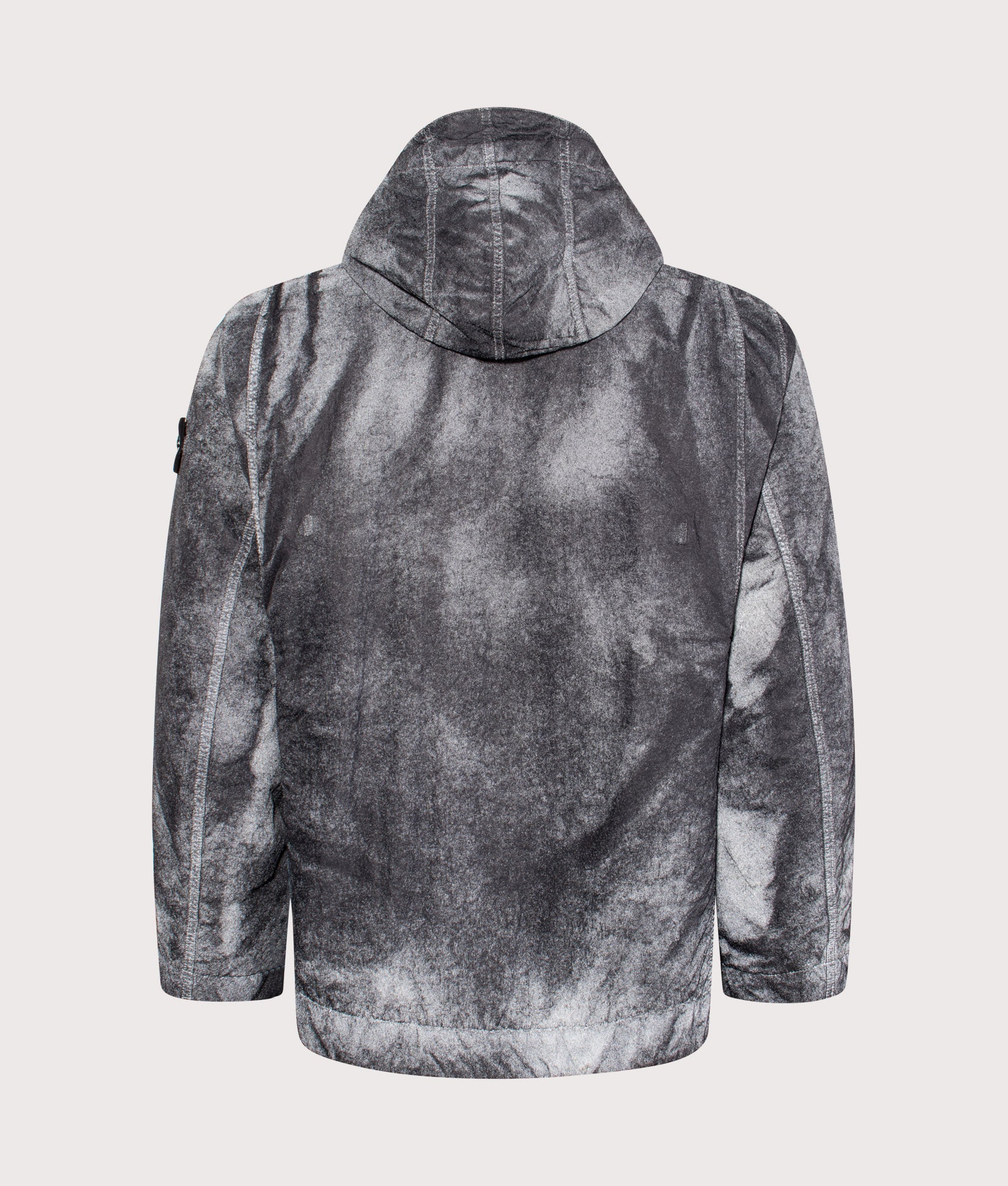 Stone Island Dense Nylon-TC Hand Sprayed Reflective Jacket in Black at EQVVS Menswear. Reflective back shot.