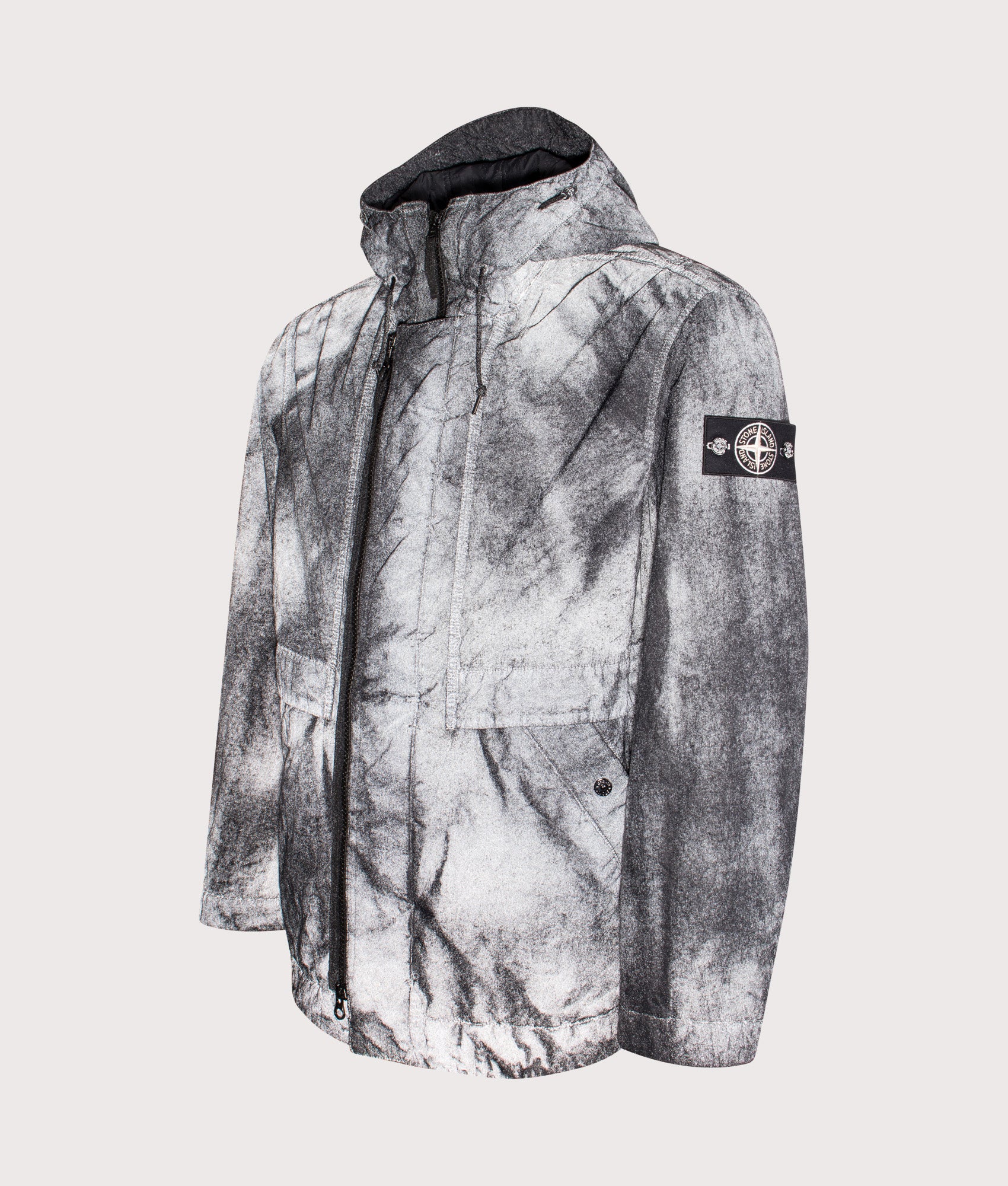 Stone Island Dense Nylon-TC Hand Sprayed Reflective Jacket in Black at EQVVS Menswear. Reflective angled front shot.