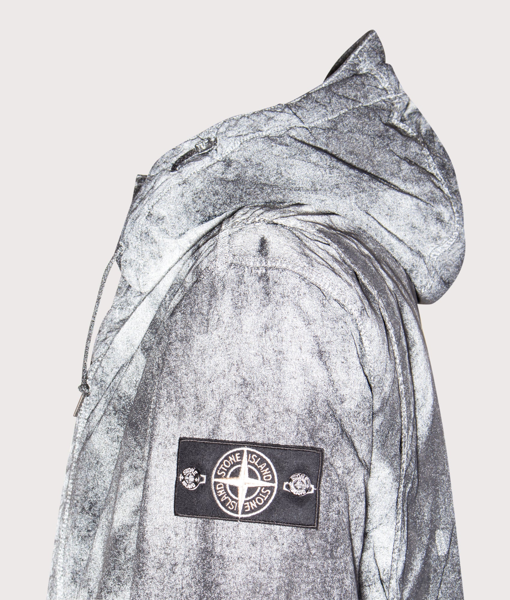 Stone Island Dense Nylon-TC Hand Sprayed Reflective Jacket in Black at EQVVS Menswear. Reflective detail shot.