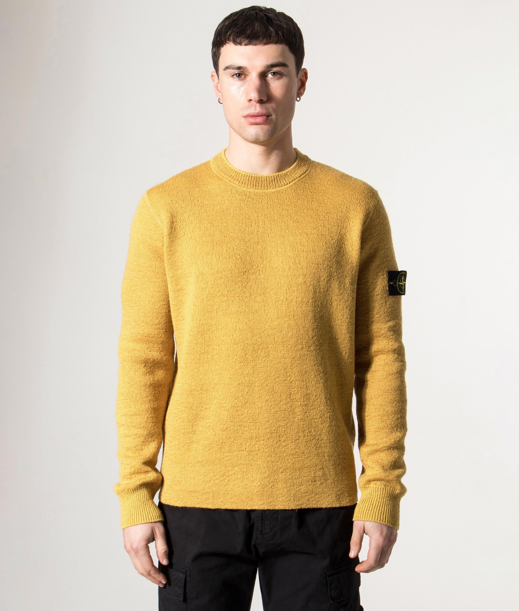Stone Island Relaxed Fit Rubberised RWS Wool Jumper in Mustard at EQVVS  Menswear. Model front shot.