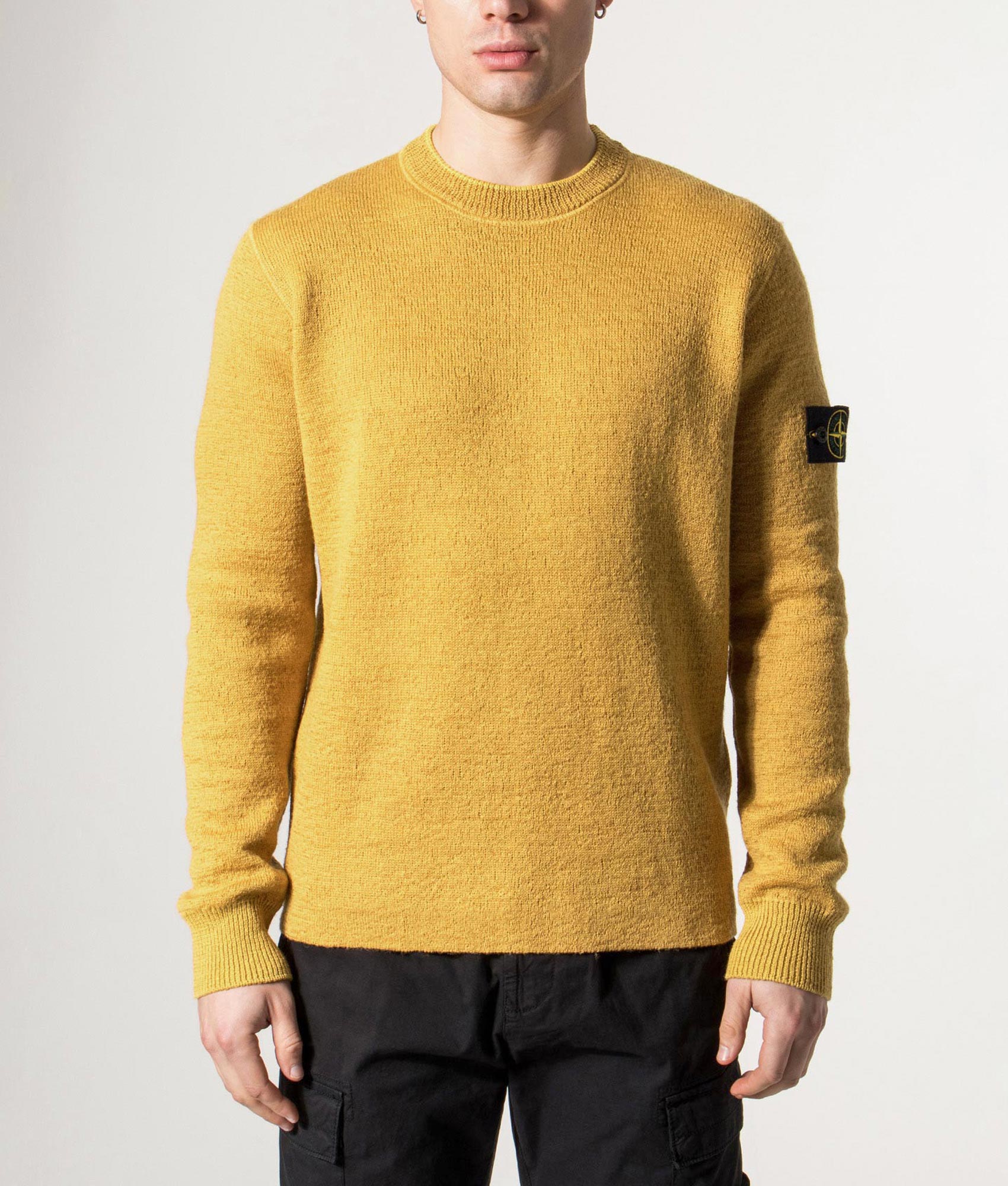 Stone Island Relaxed Fit Rubberised RWS Wool Jumper in Mustard at EQVVS  Menswear. Model front shot.