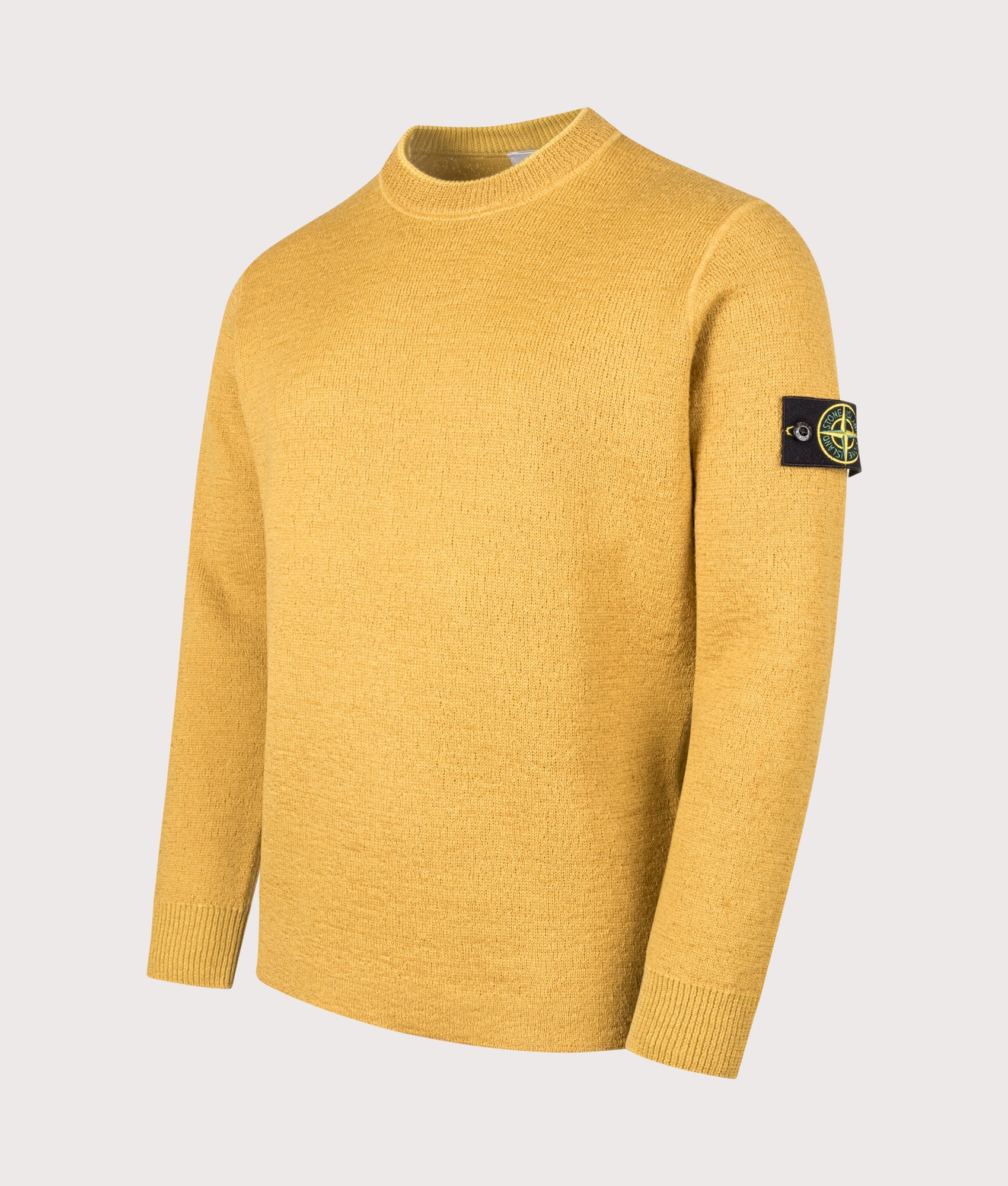 Stone Island Relaxed Fit Rubberised RWS Wool Jumper in Mustard at EQVVS  Menswear. Front angle shot. 