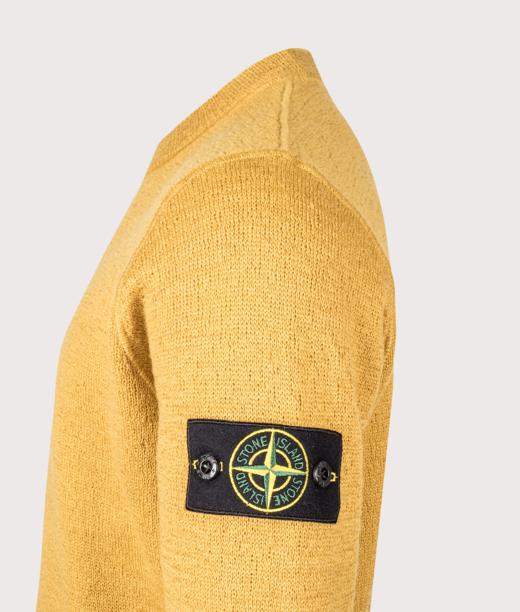Relaxed Fit Rubberised RWS Wool Jumper in Mustard | Stone Island | EQVVS | Side detail shot 