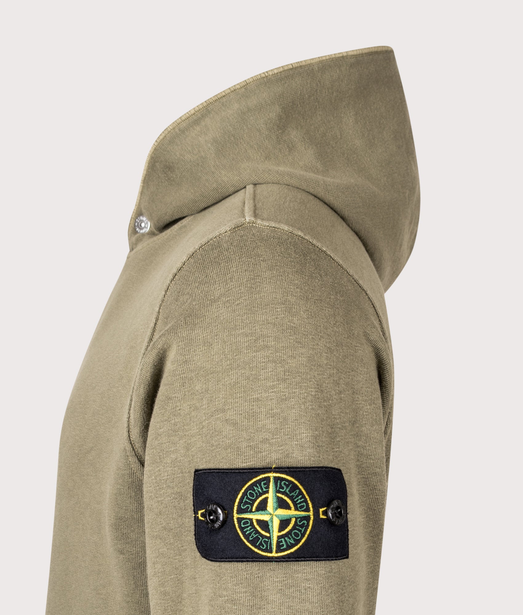Stone Island Malfilé Fleece 'Old' Effect Hoodie in Military Green at EQVVS Menswear. Detail shot.