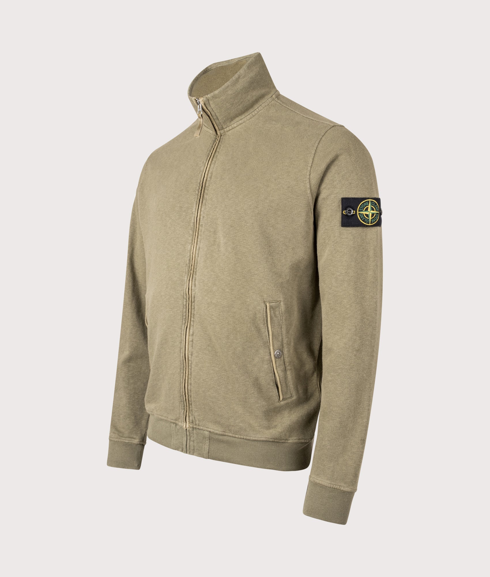 Stone Island Malfilé ‘Old’ Treatment Zip Up Track Jacket in Military green at EQVVS Menswear. Angled front shot.