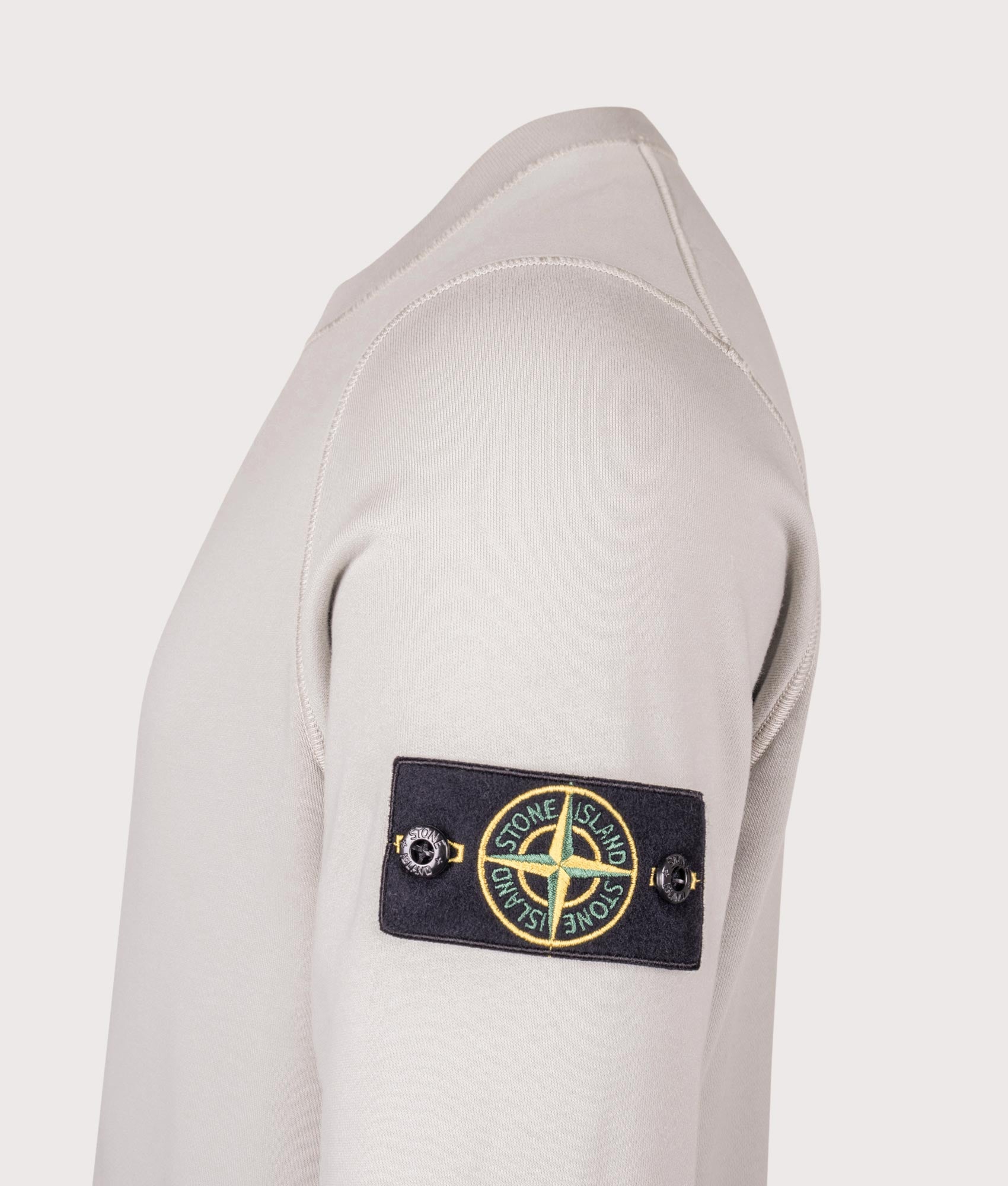 Stone Island Organic Cotton Sweatshirt in Pearl Grey at EQVVS Menswear. Detail shot.