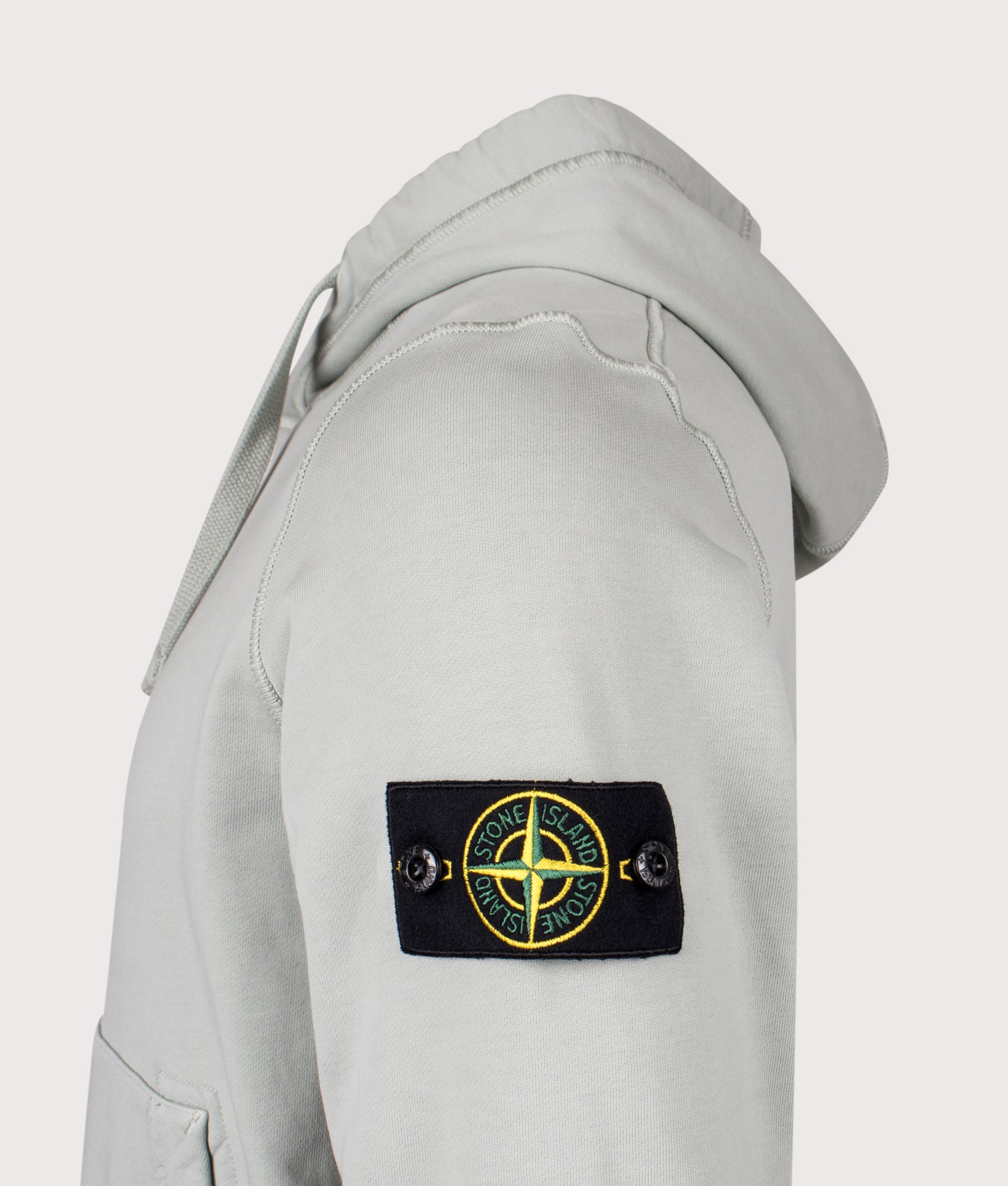 Stone Island Organic Cotton Hoodie in Sage at EQVVS Menswear. Detail shot.
