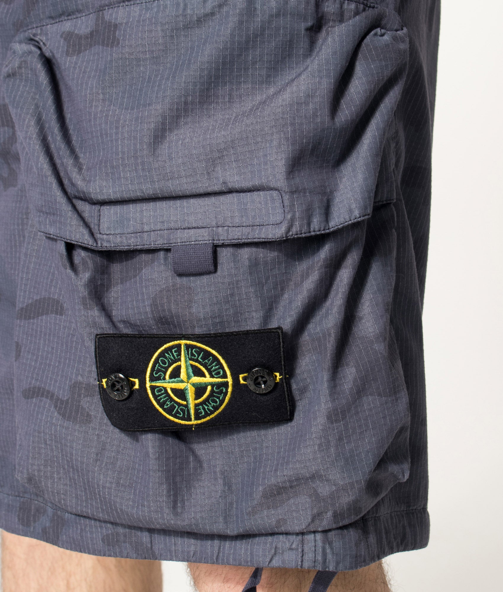 Stone Island Cotton Nylon Micro Ripstop Cargo Shorts in Blue Grey at EQVVS Menswear. Detail shot.