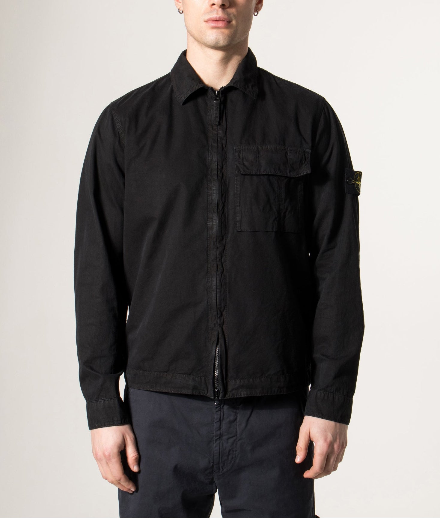 Stone Island Brushed Organic Cotton Canvas ‘OLD’ Effect Overshirt in Black at EQVVS Menswear. Model front shot.
