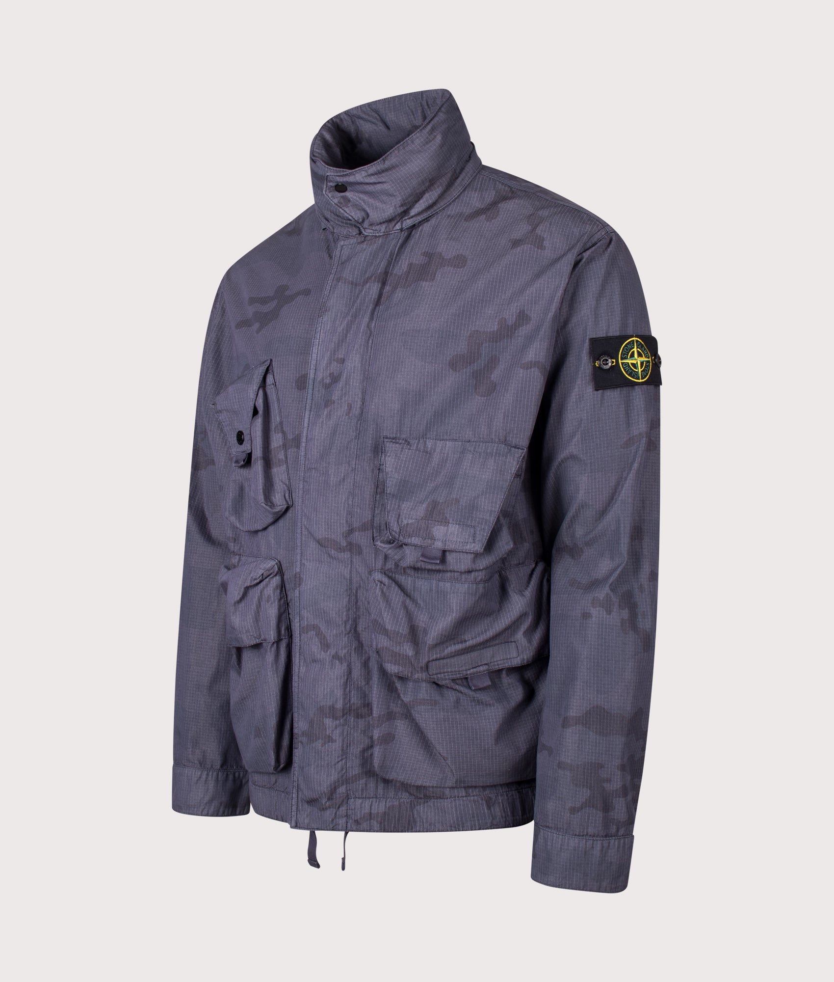 Stone Island Faded Camo Light Ripstop-OVD Field Jacket in Blue Grey at EQVVS Menswear. Angled front shot.