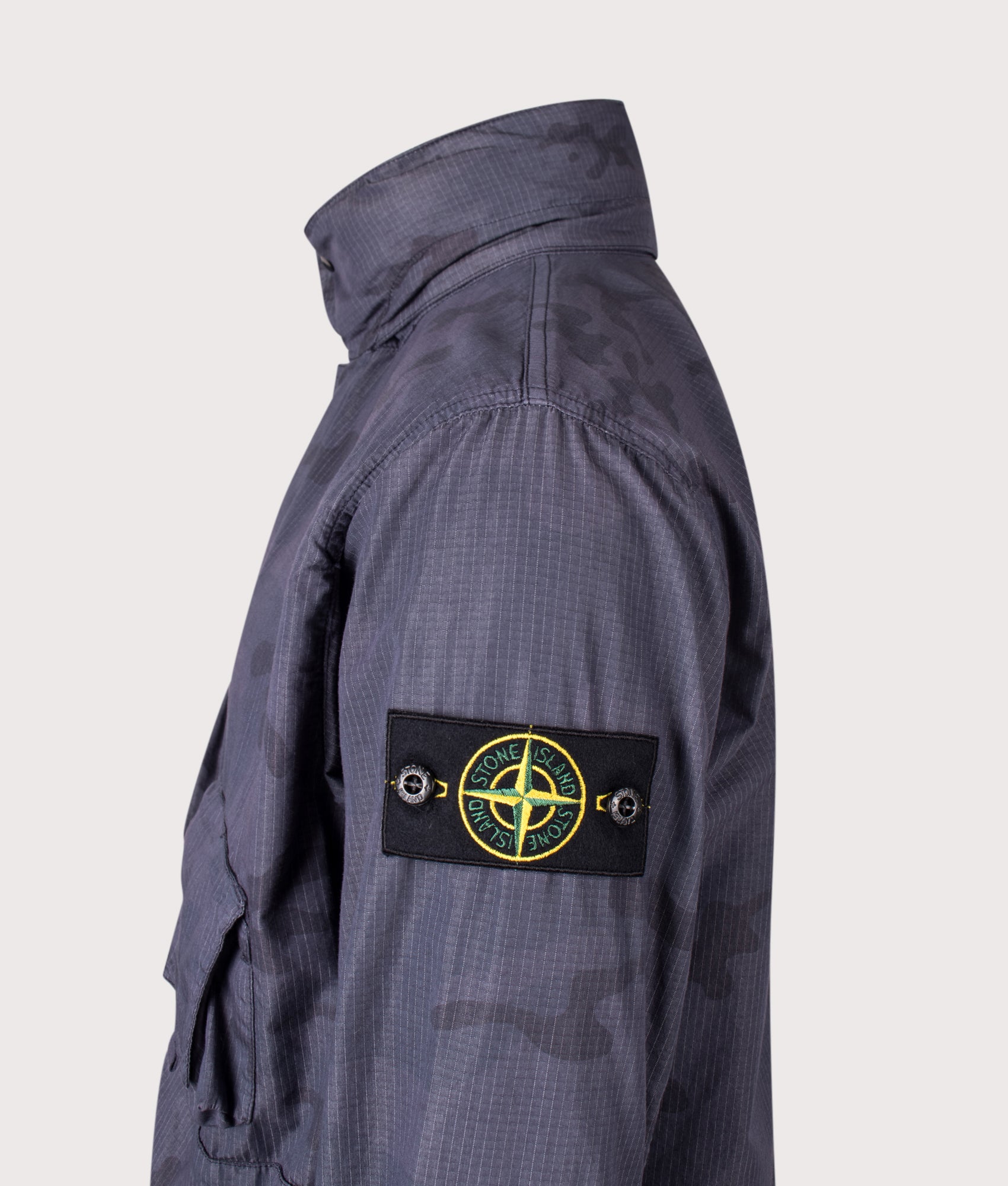 Stone Island Faded Camo Light Ripstop-OVD Field Jacket in Blue Grey at EQVVS Menswear. Detail shot.