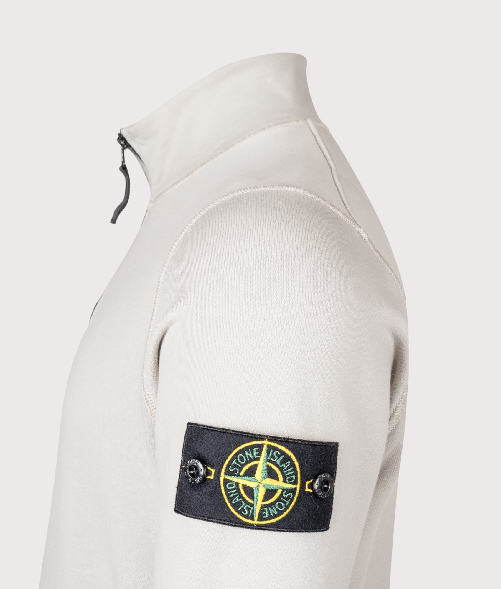 Stone Island Quarter Zip Sweatshirt in Pearl Grey at EQVVS Menswear. Detail shot.