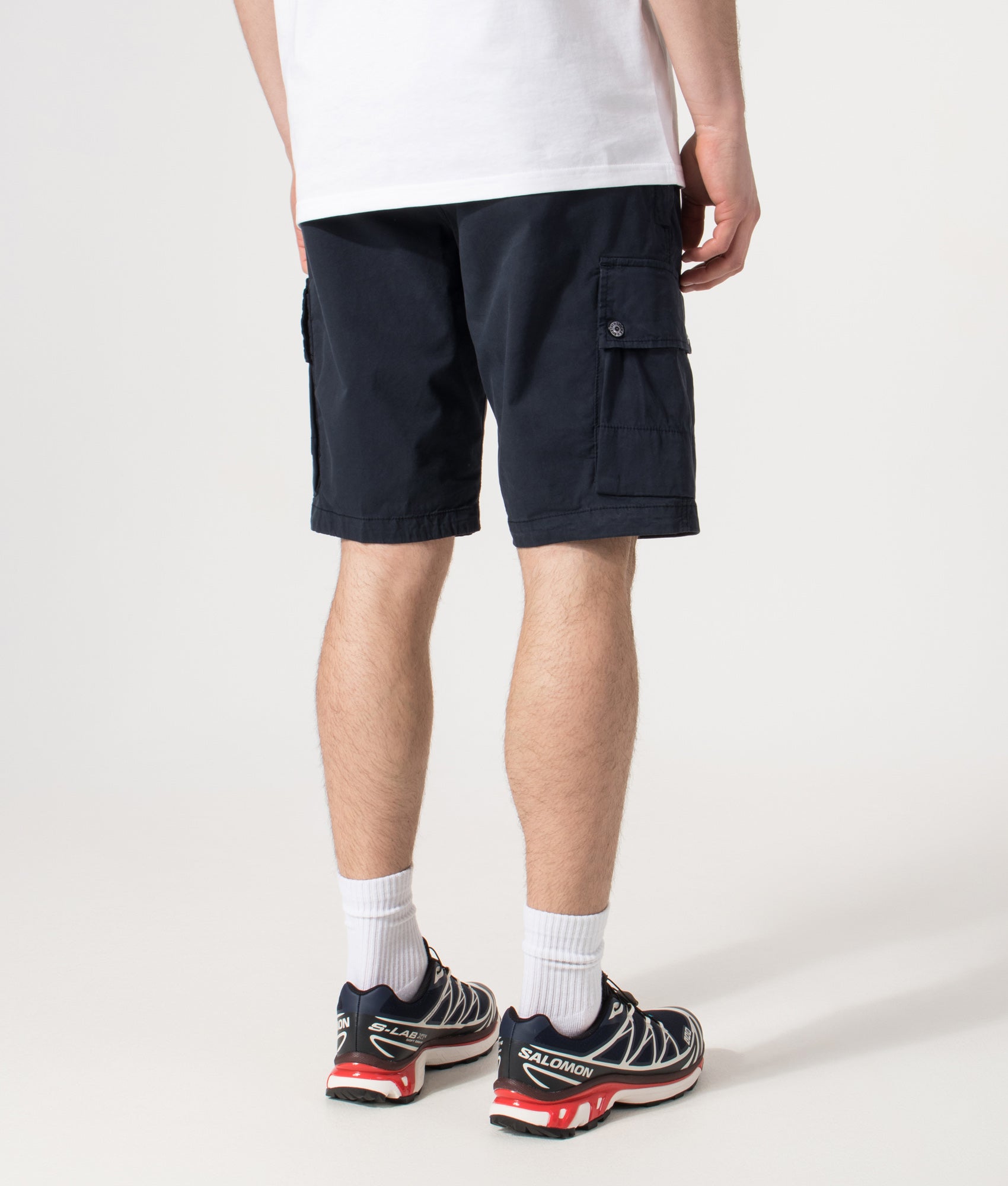 Stone Island Cargo Shorts in Navy at EQVVS Menswear. Angled back shot.