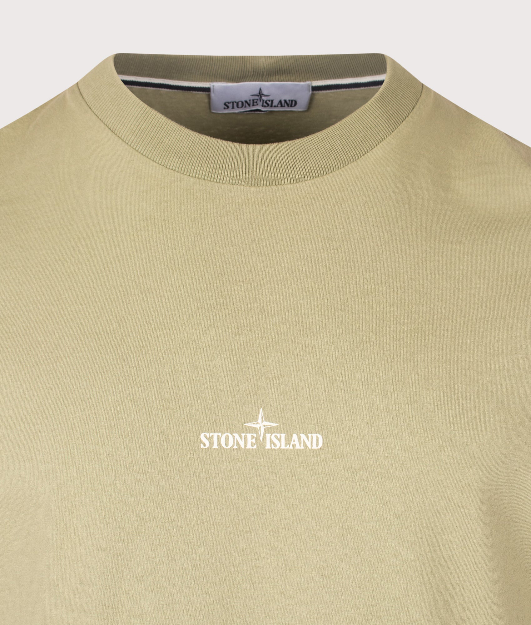 Stone Island Organic Cotton 'DESERT' Print T-Shirt in Laurel Green at EQVVS Menswear. Detail shot.