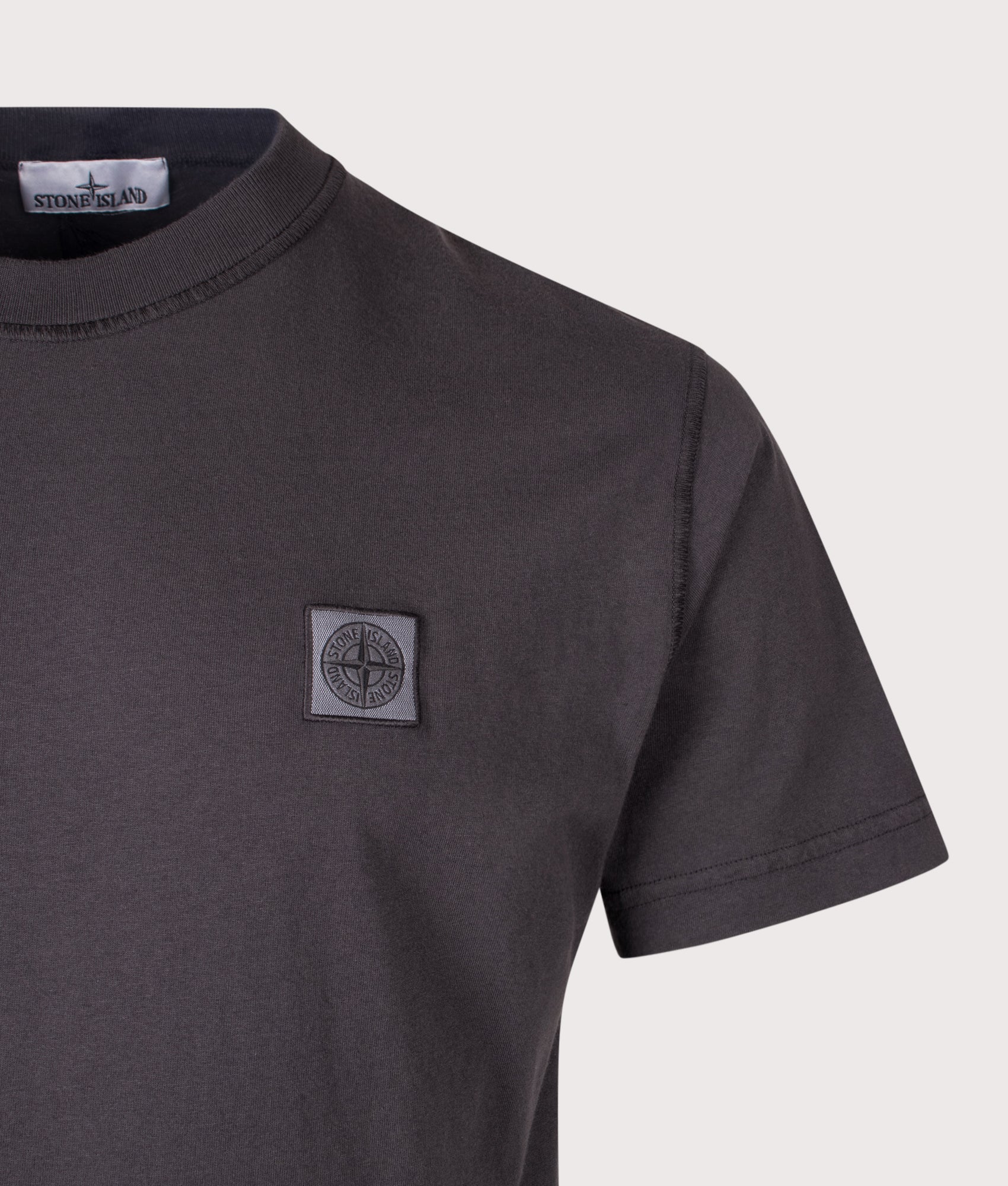 Stone Island Slim Fit Organic Cotton 'FISSATO' Effect T-Shirt in Charcoal at EQVVS Menswear. Detail shot.