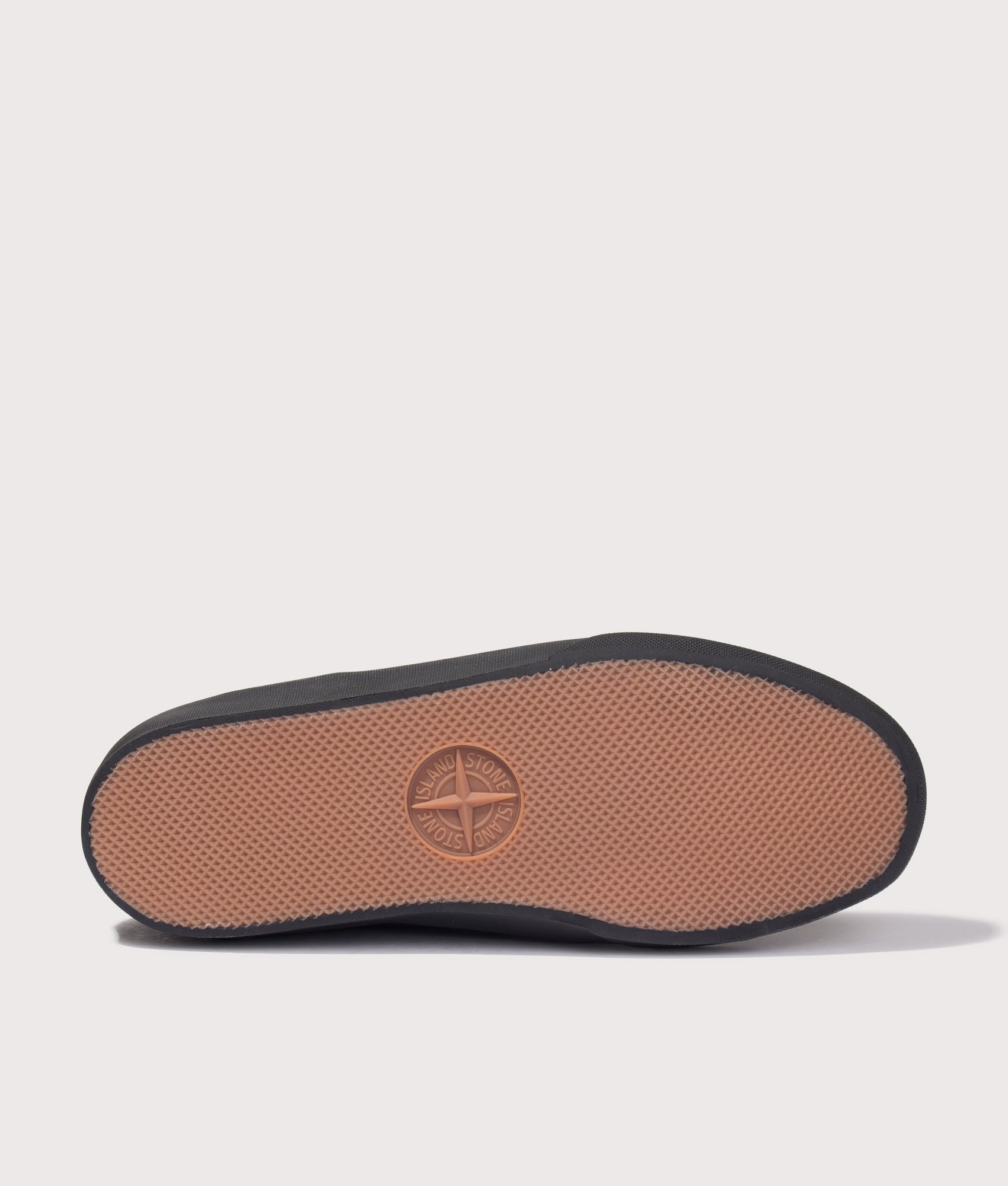 Stone Island Canvas Suede Low Top Trainers in Black at EQVVS Menswear. Tread shot.
