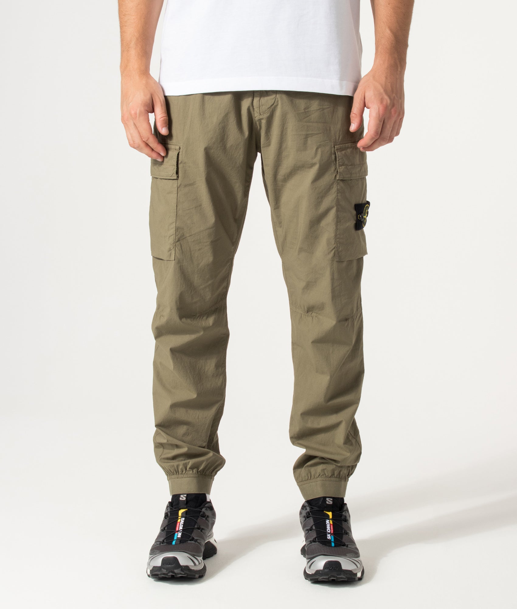 Stone Island Regular Tapered Fit Cargo Pants in Military Green at EQVVS Menswear. Front shot.