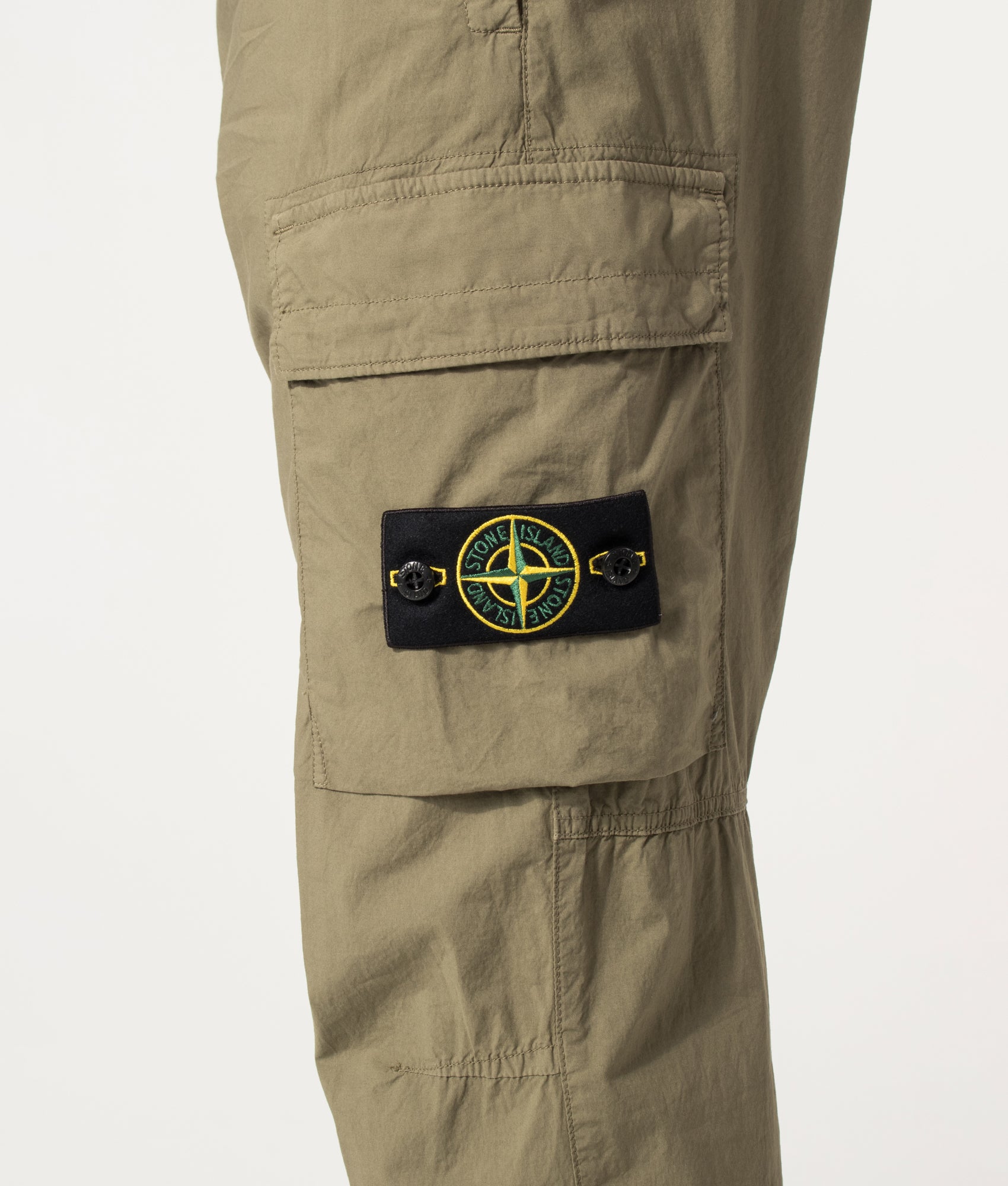 Stone Island Regular Tapered Fit Cargo Pants in Military Green at EQVVS Menswear. Detail shot.