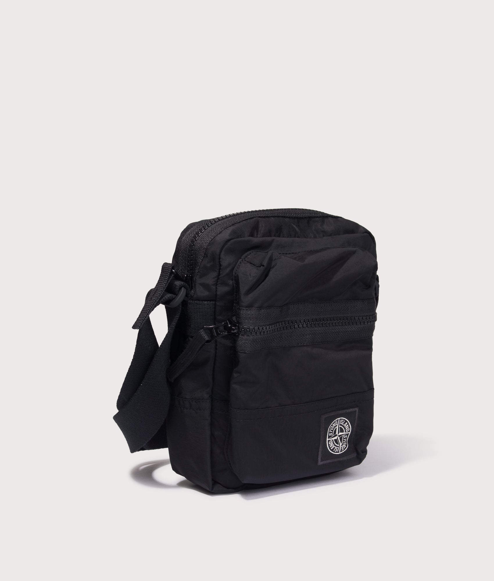 Stone Island Coated Nylon Metal in Econyl® Crossbody Bag in Black at EQVVS Menswear. Detail shot.