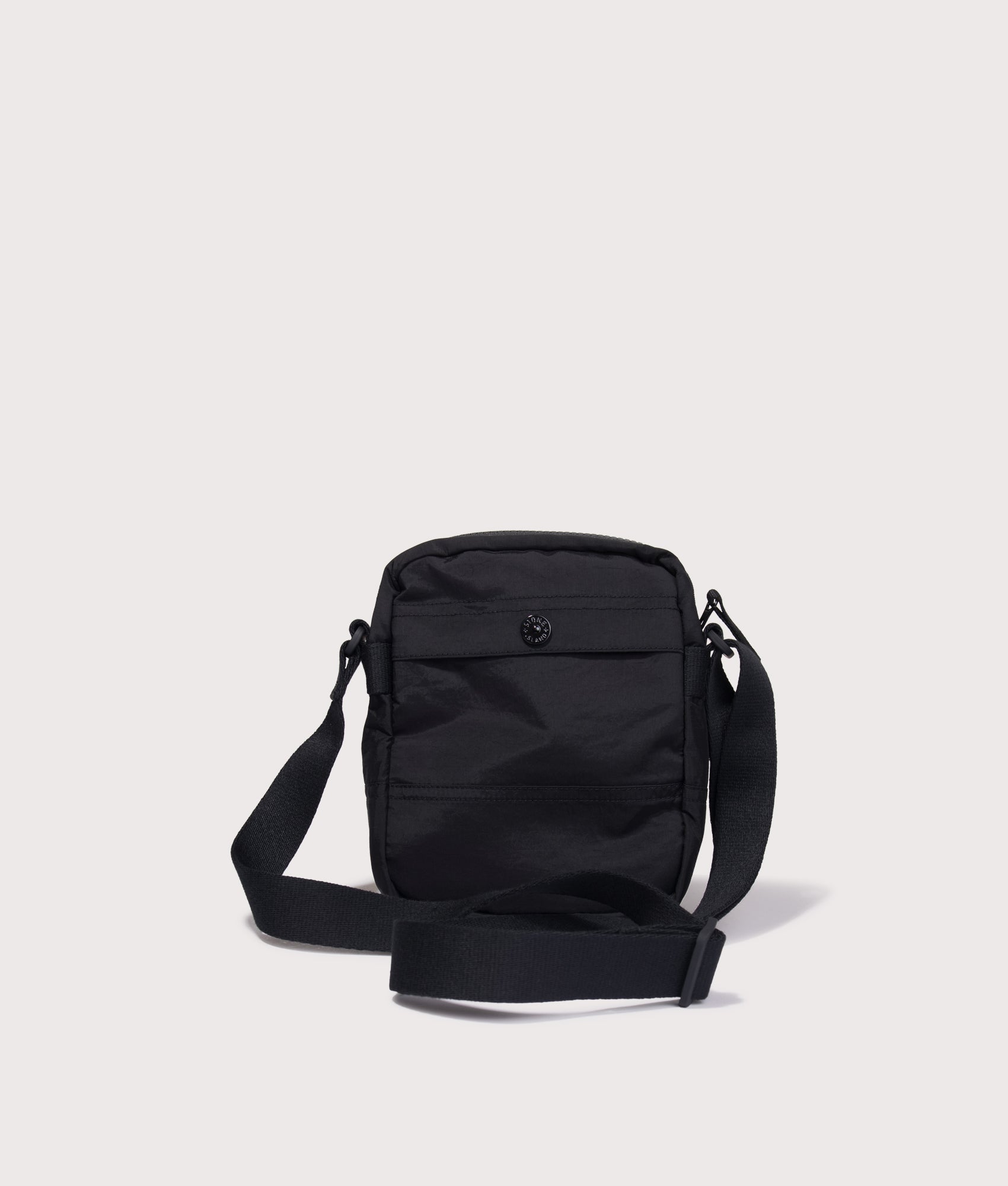 Stone Island Coated Nylon Metal in Econyl® Crossbody Bag in Black at EQVVS Menswear. Back shot.
